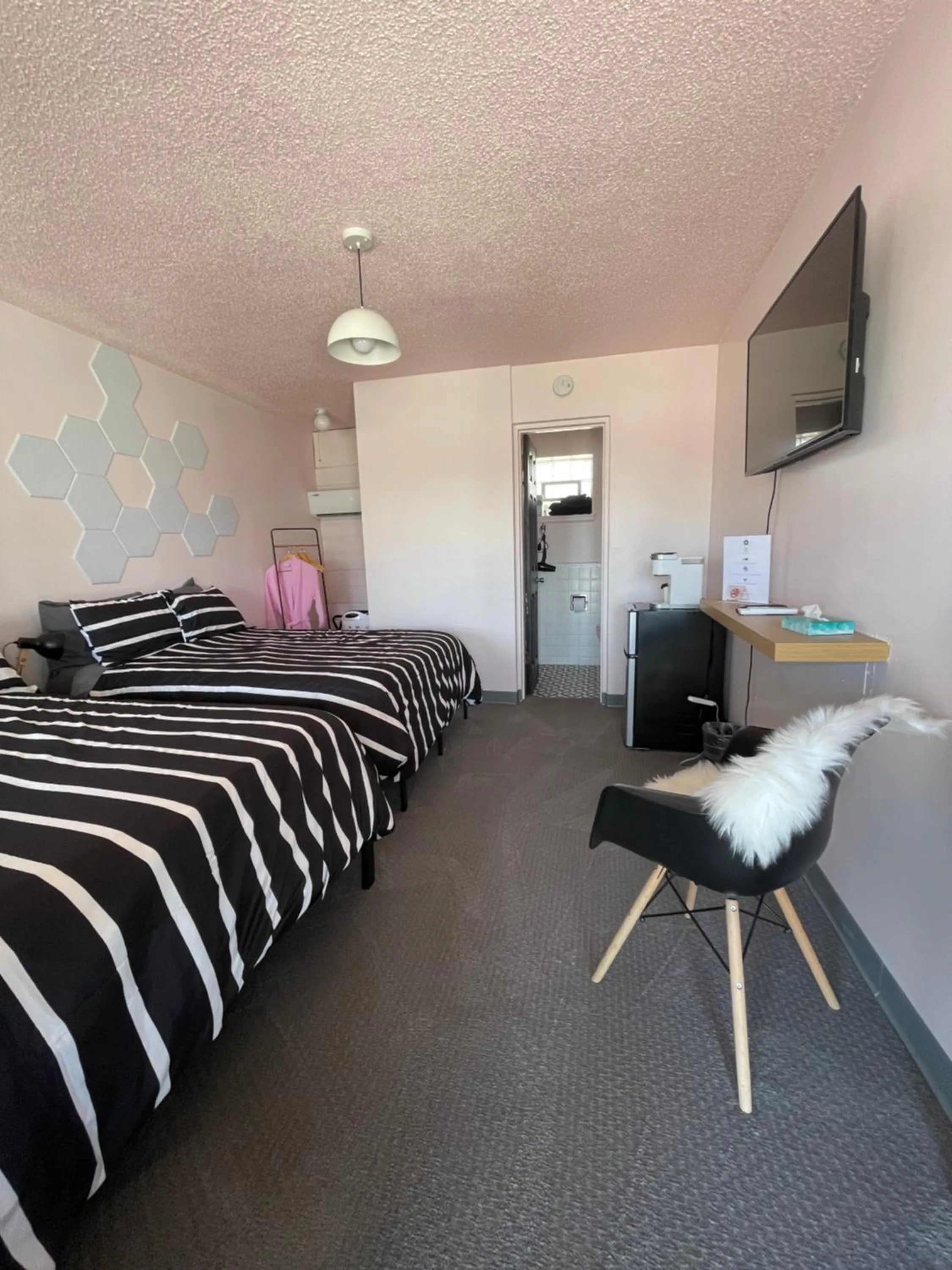 Bed in Rainbow Motel