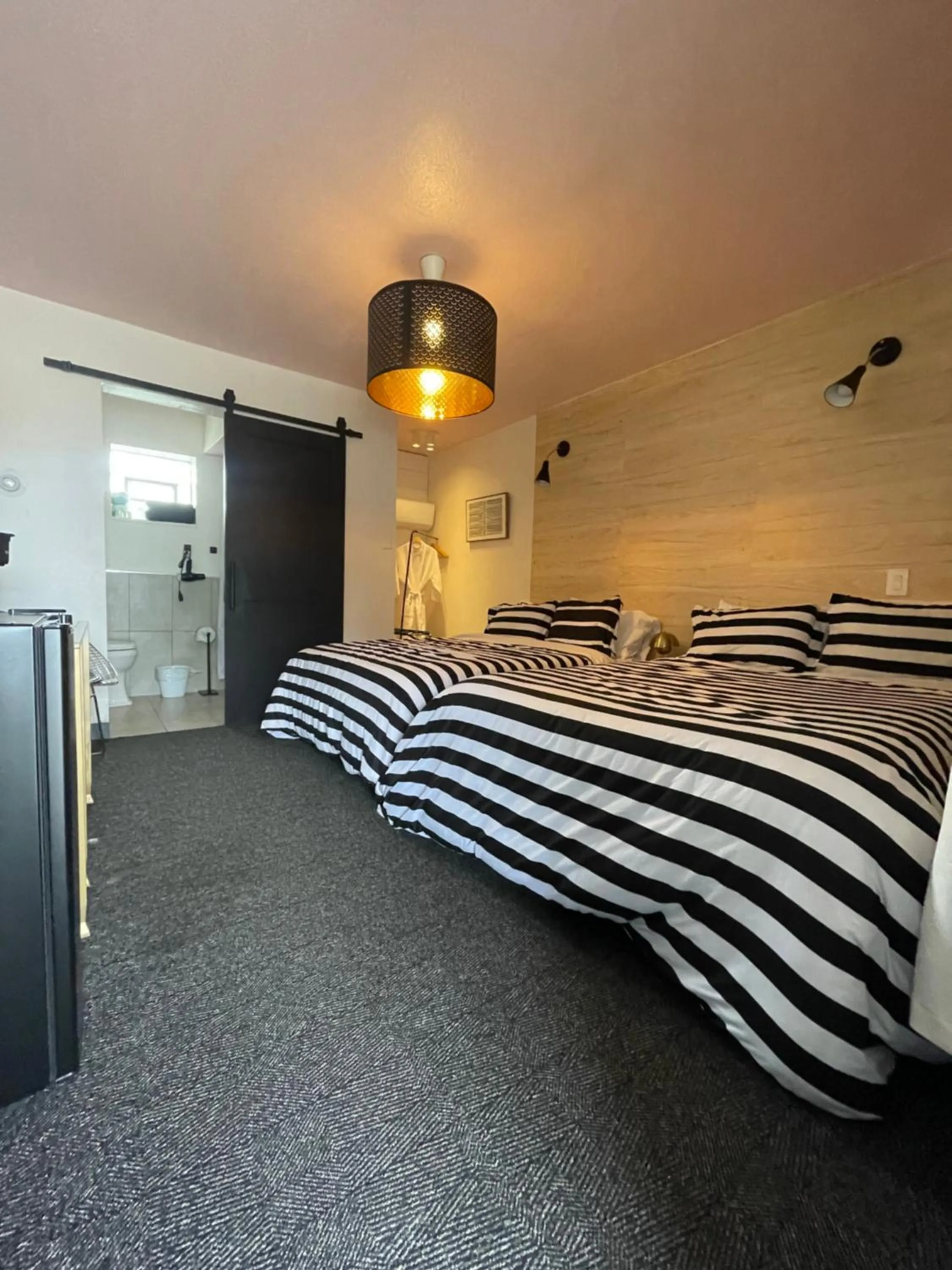 Bed in Rainbow Motel