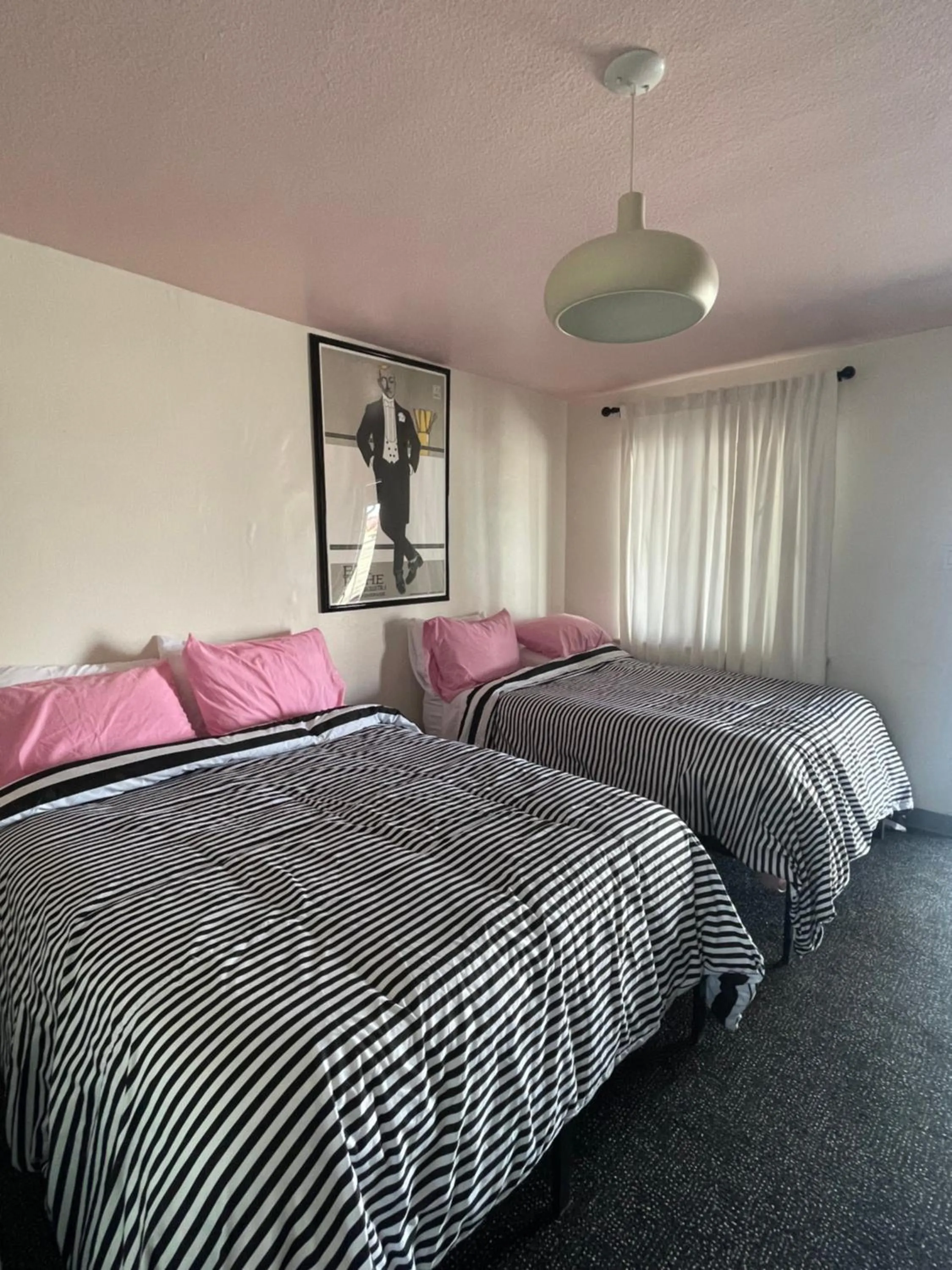 Bed in Rainbow Motel