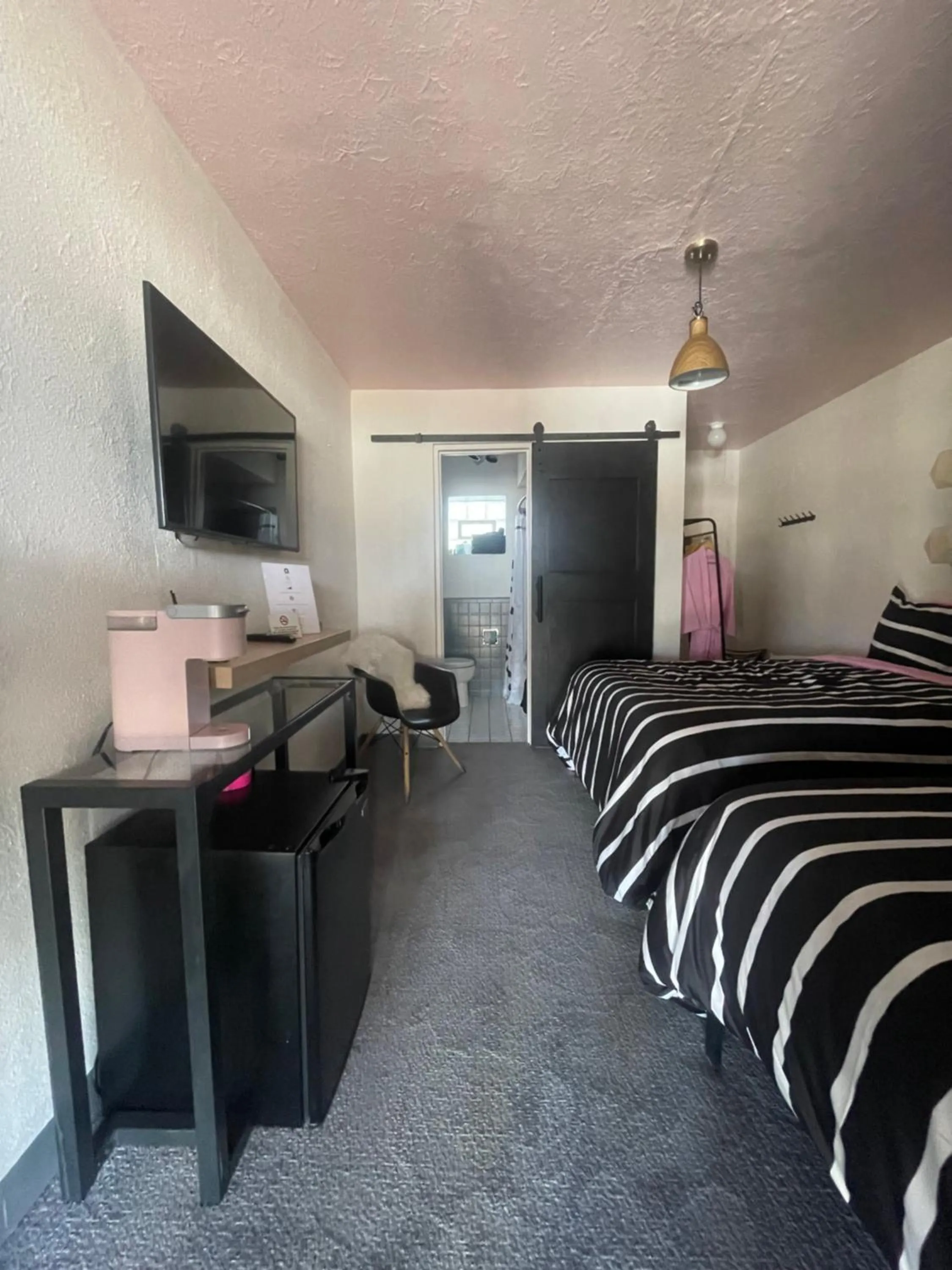 Bed in Rainbow Motel