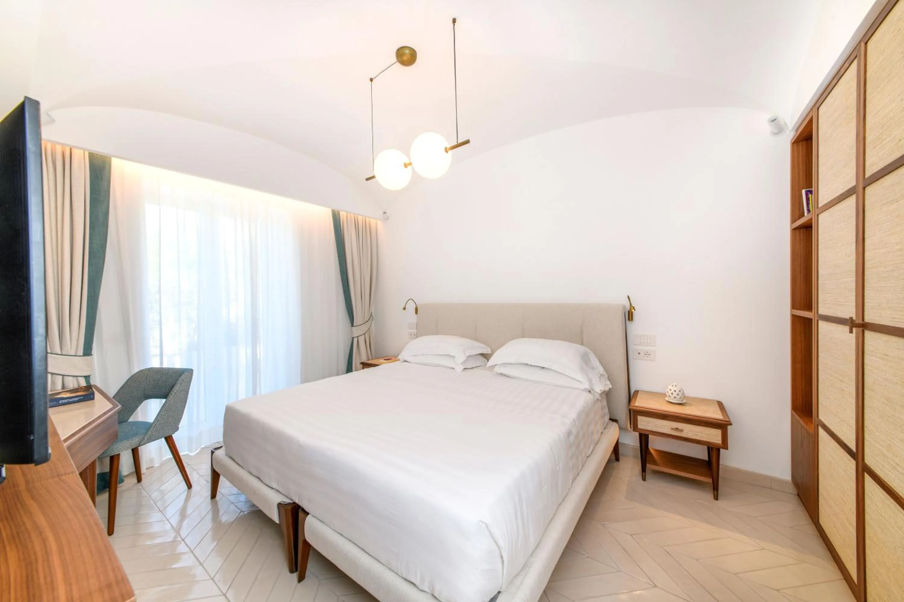 Seating area, Bed in OraBlu Villas