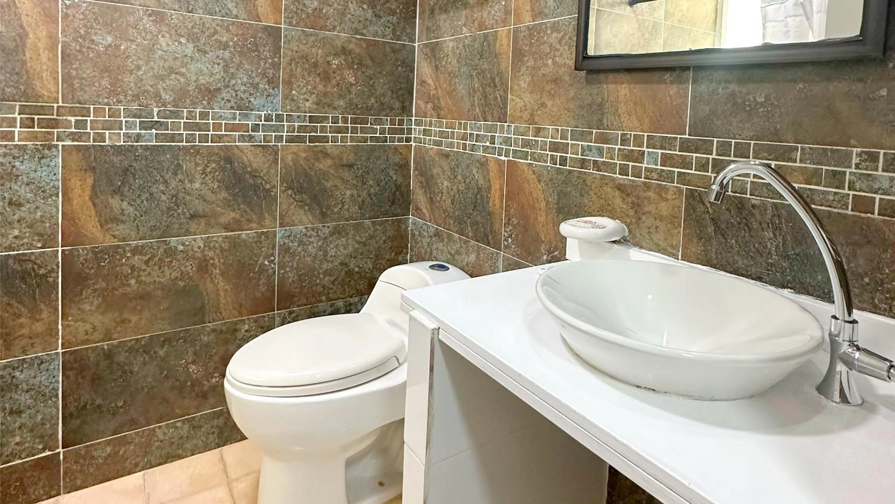 Bathroom in Hotel Blue Cove by On vacation