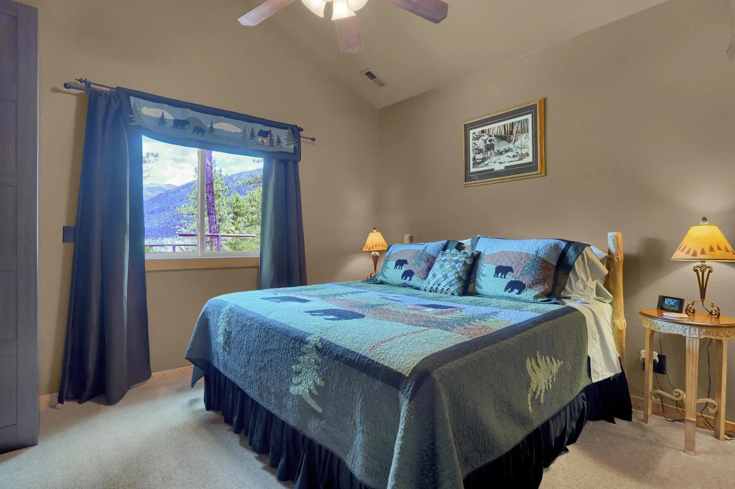 Bed in Pikes Peak Guest Cabin at Rocky Mountain Lodge