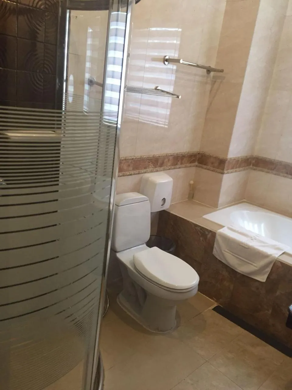 Toilet in Seasons Riverside Hotel