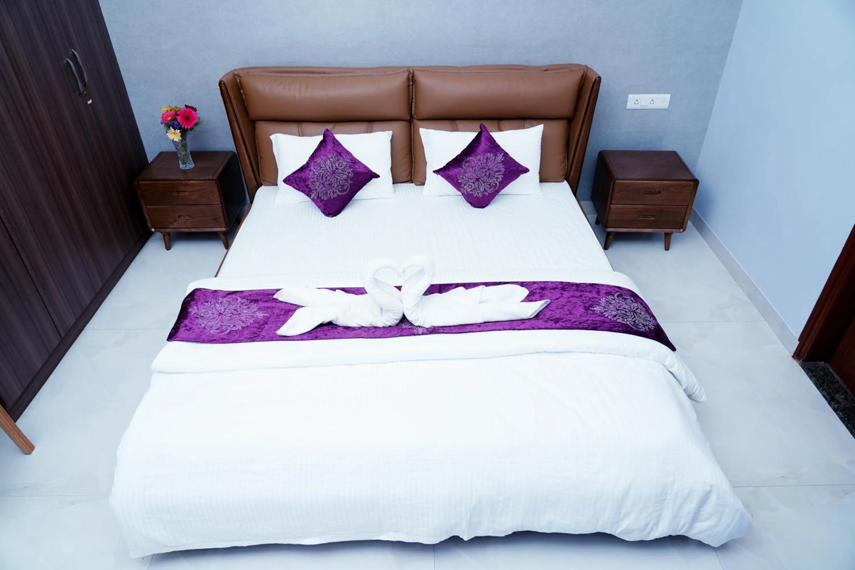 Bed in UNNATHI SUITES