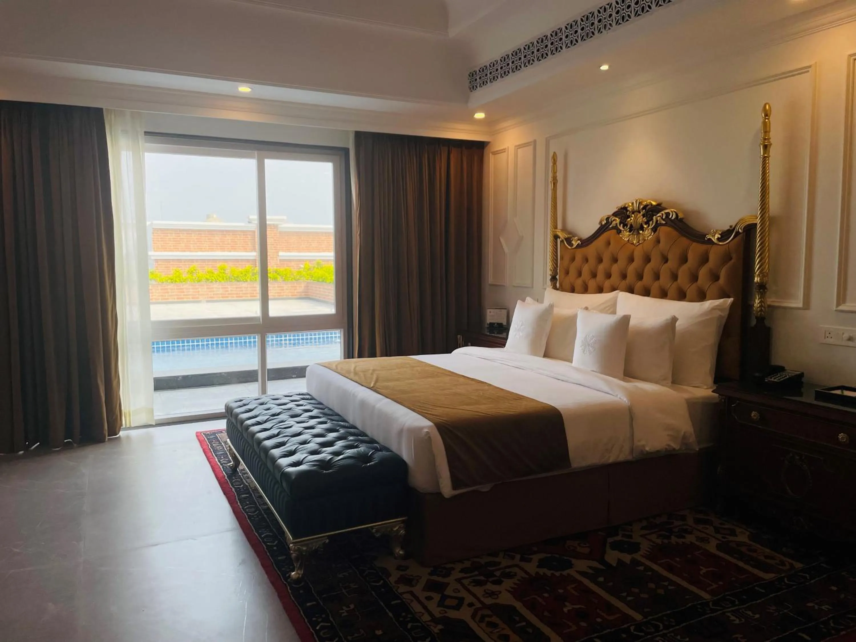 Bed in Mayfair Palm Beach Resort