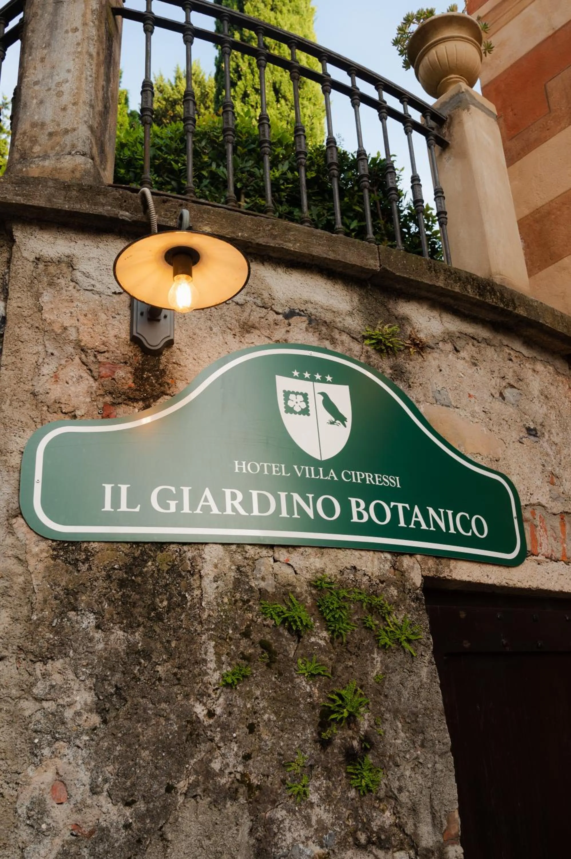 Property logo or sign in Hotel Villa Cipressi, by R Collection Hotels