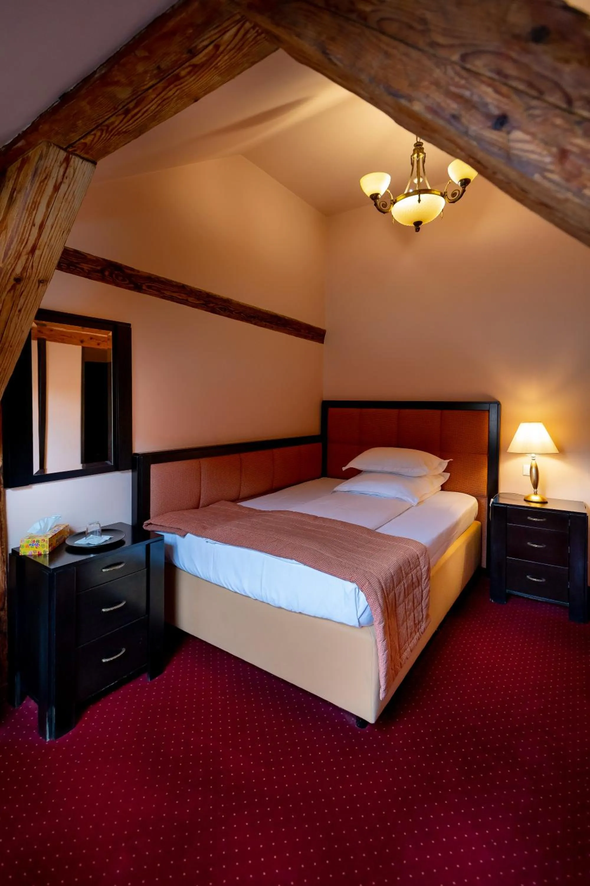 Bed in Hotel Central Park Sighisoara