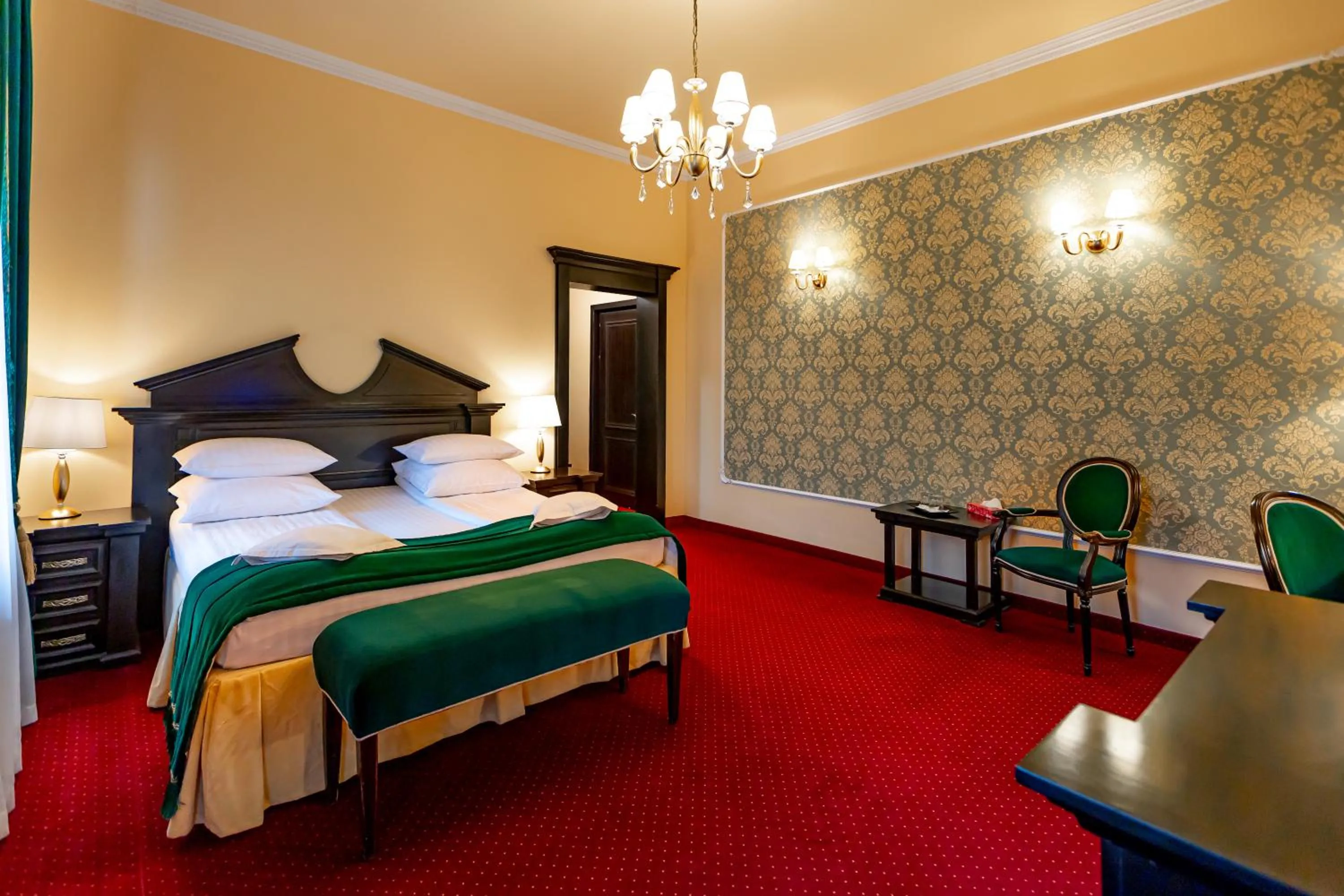 Bed in Hotel Central Park Sighisoara