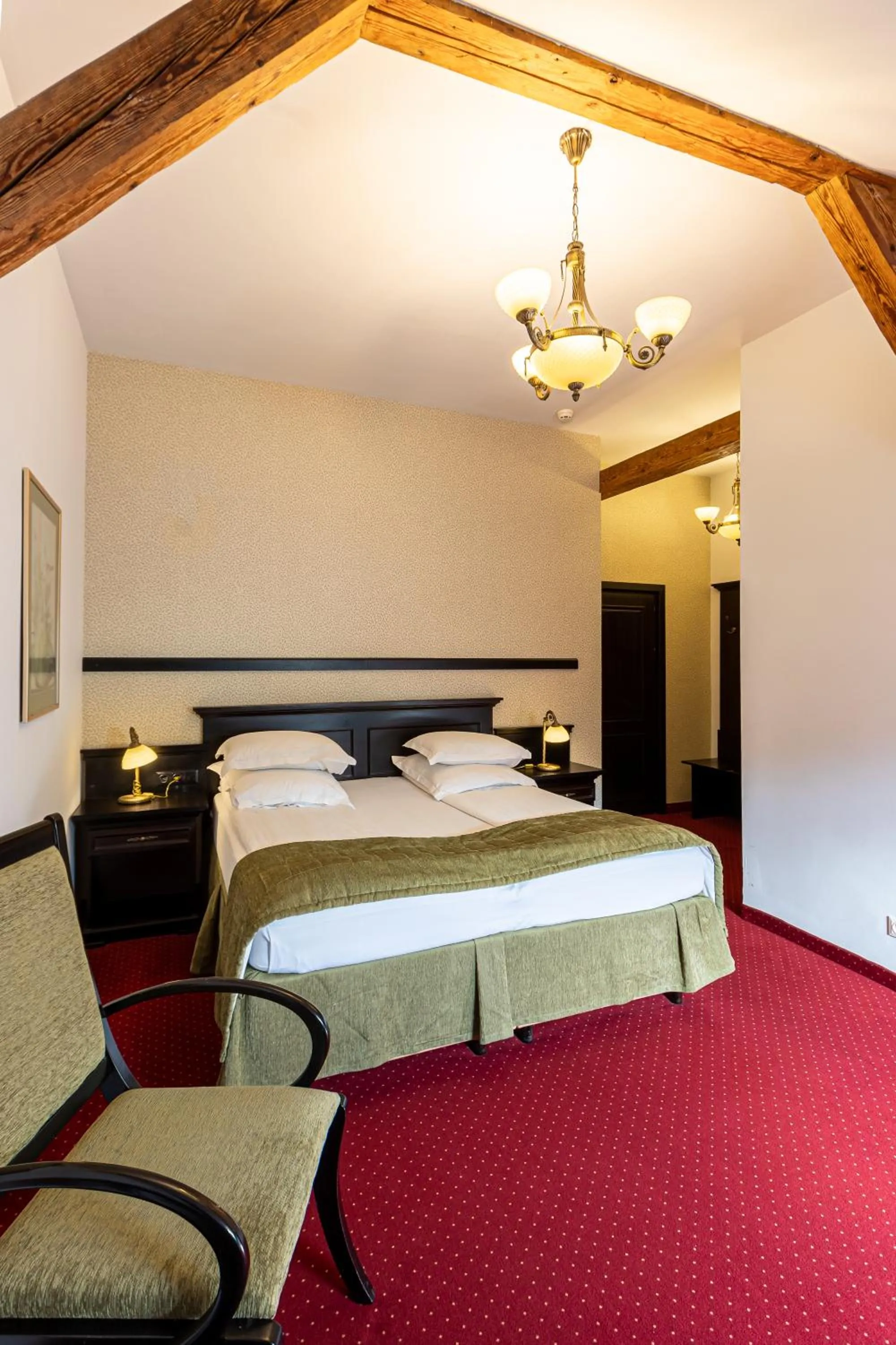 Bed in Hotel Central Park Sighisoara