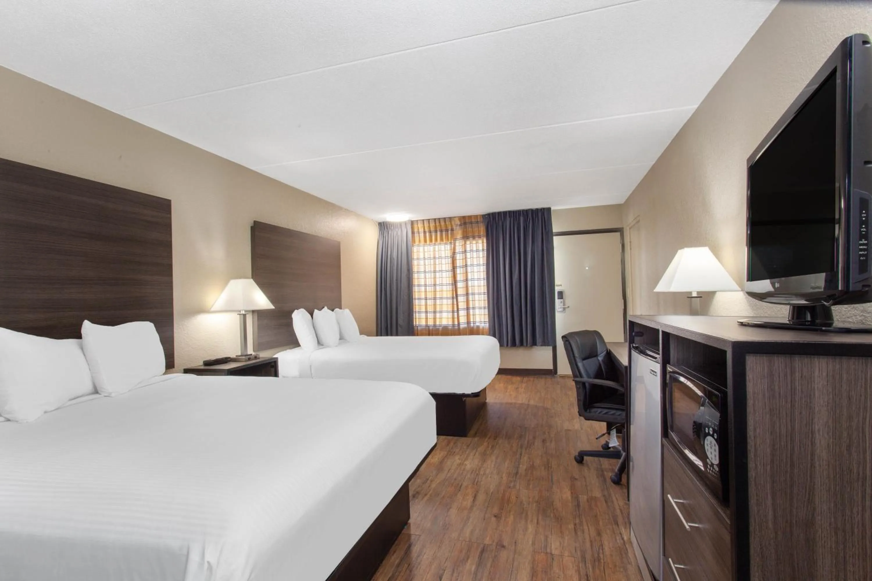 Bed in Travelodge by Wyndham Deltona