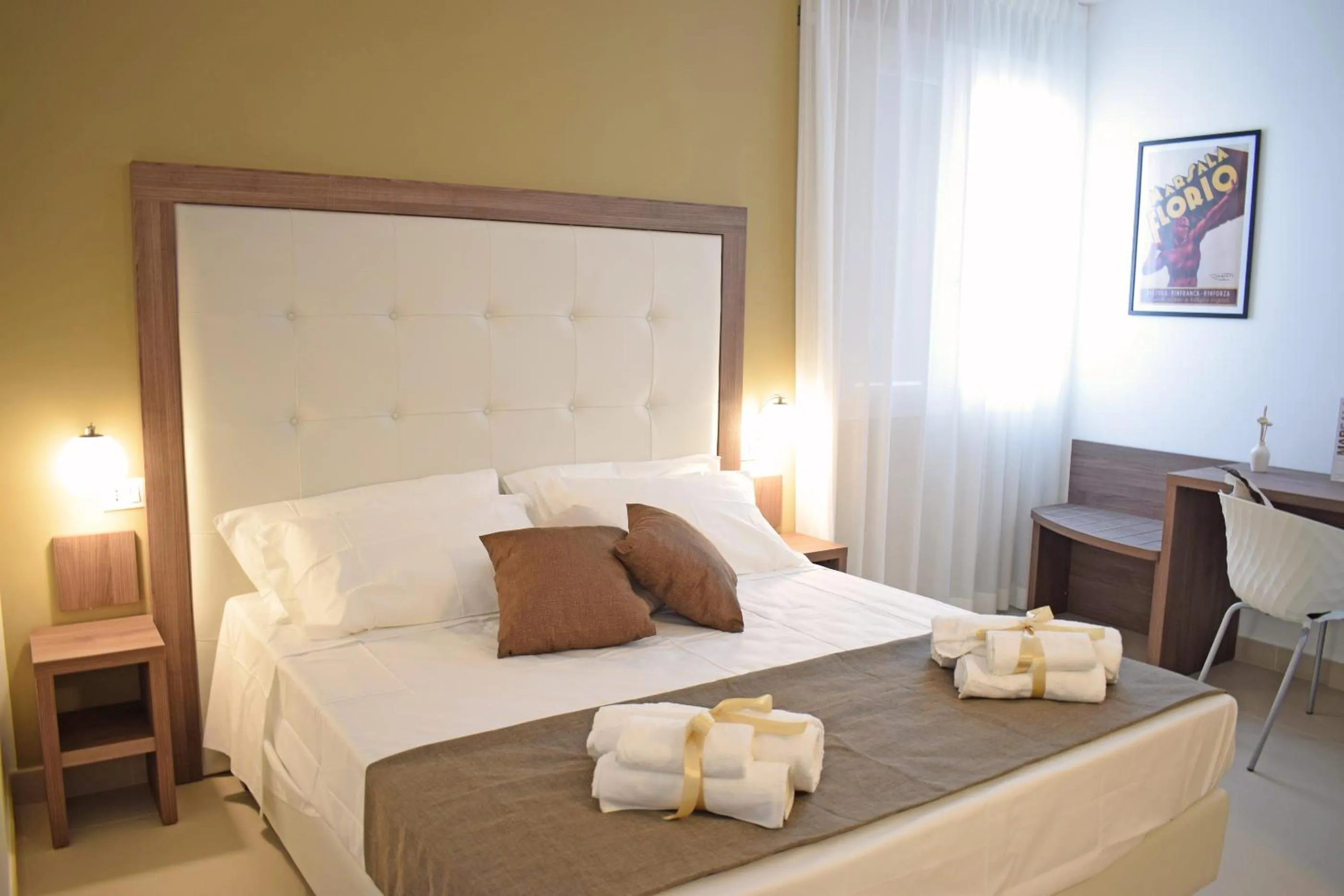 Bed in Travini Hotel Residence