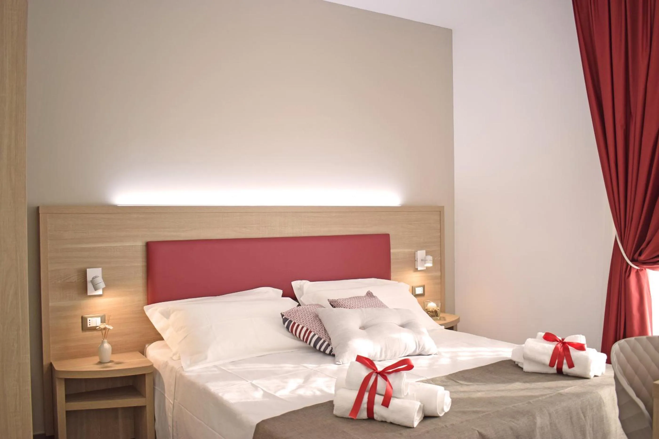 Bed in Travini Hotel Residence