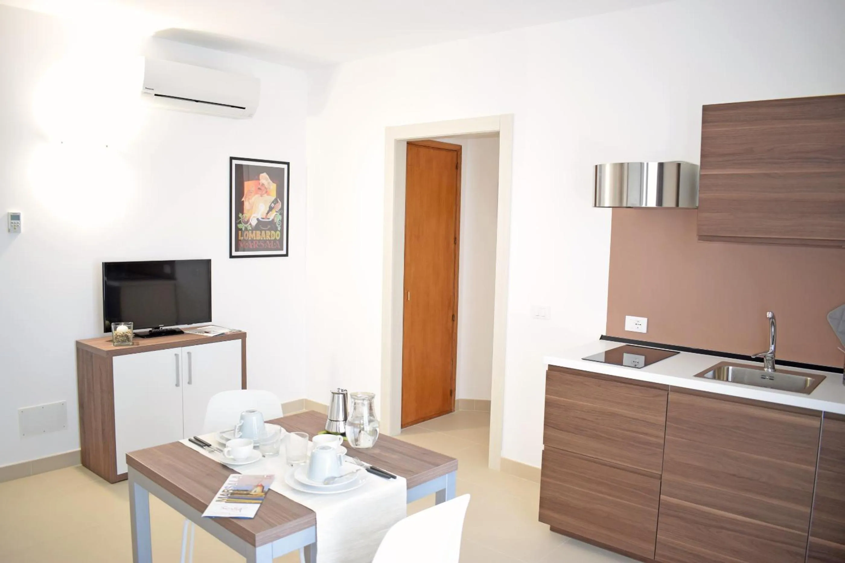 Kitchen or kitchenette in Travini Hotel Residence