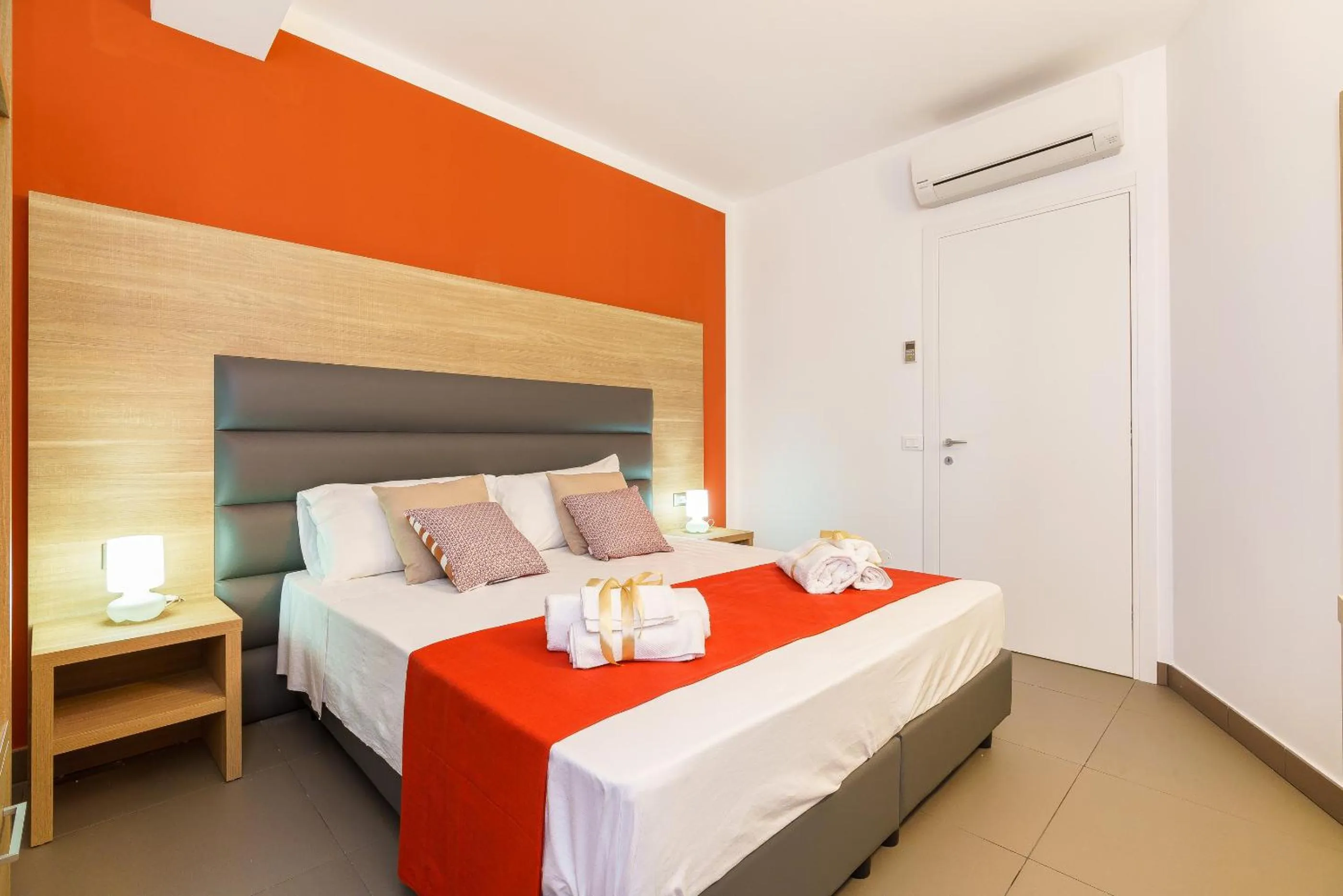 Bed in Travini Hotel Residence