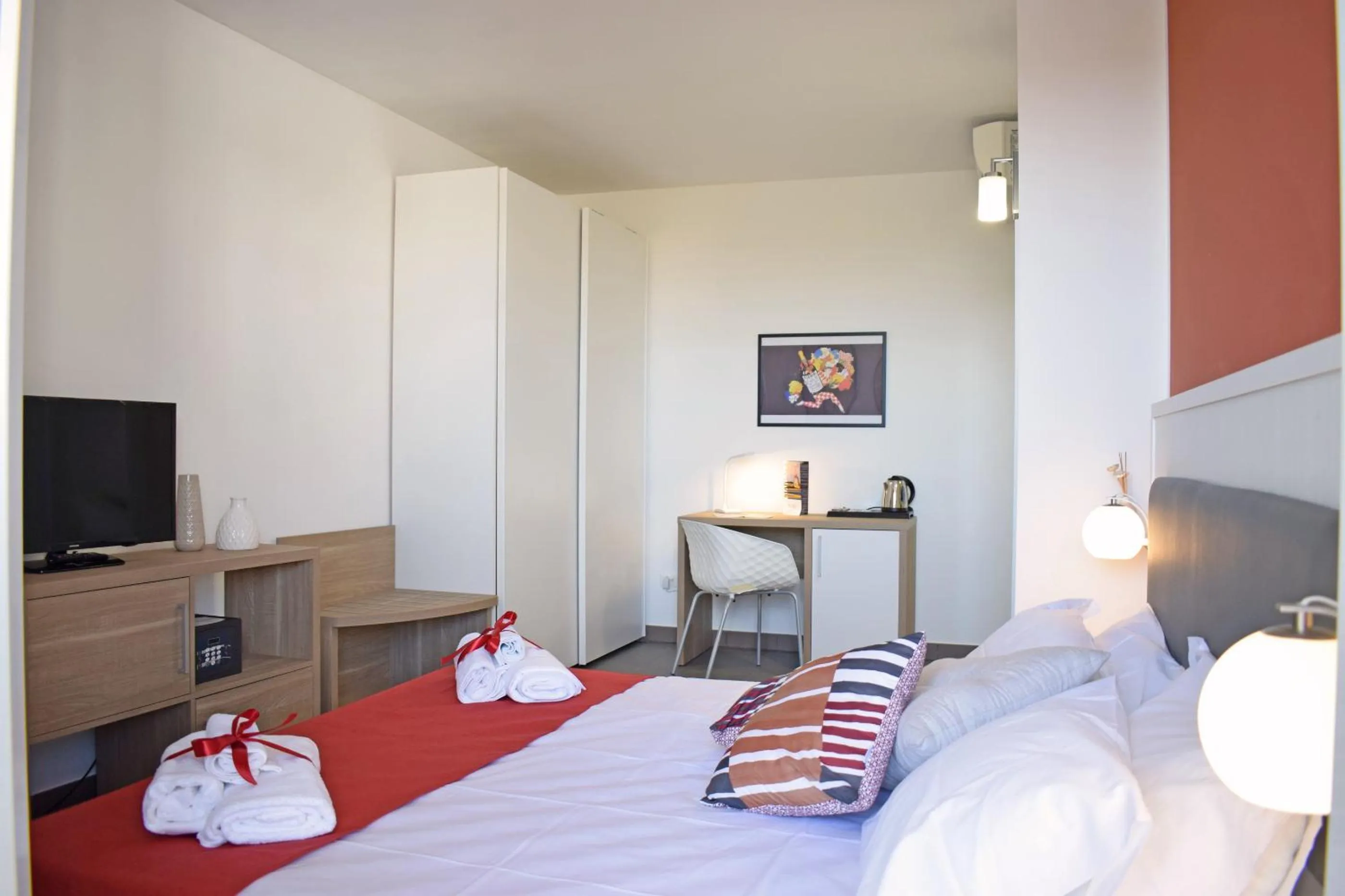 Bed in Travini Hotel Residence