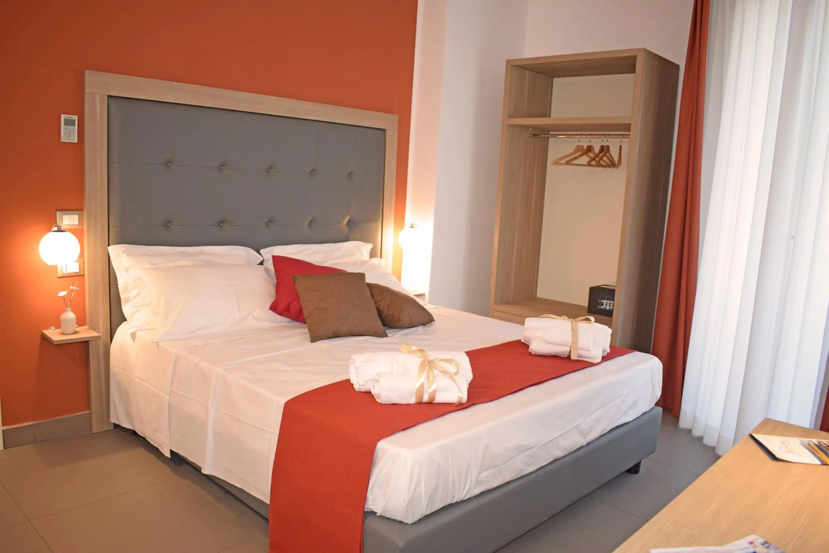 Bed in Travini Hotel Residence