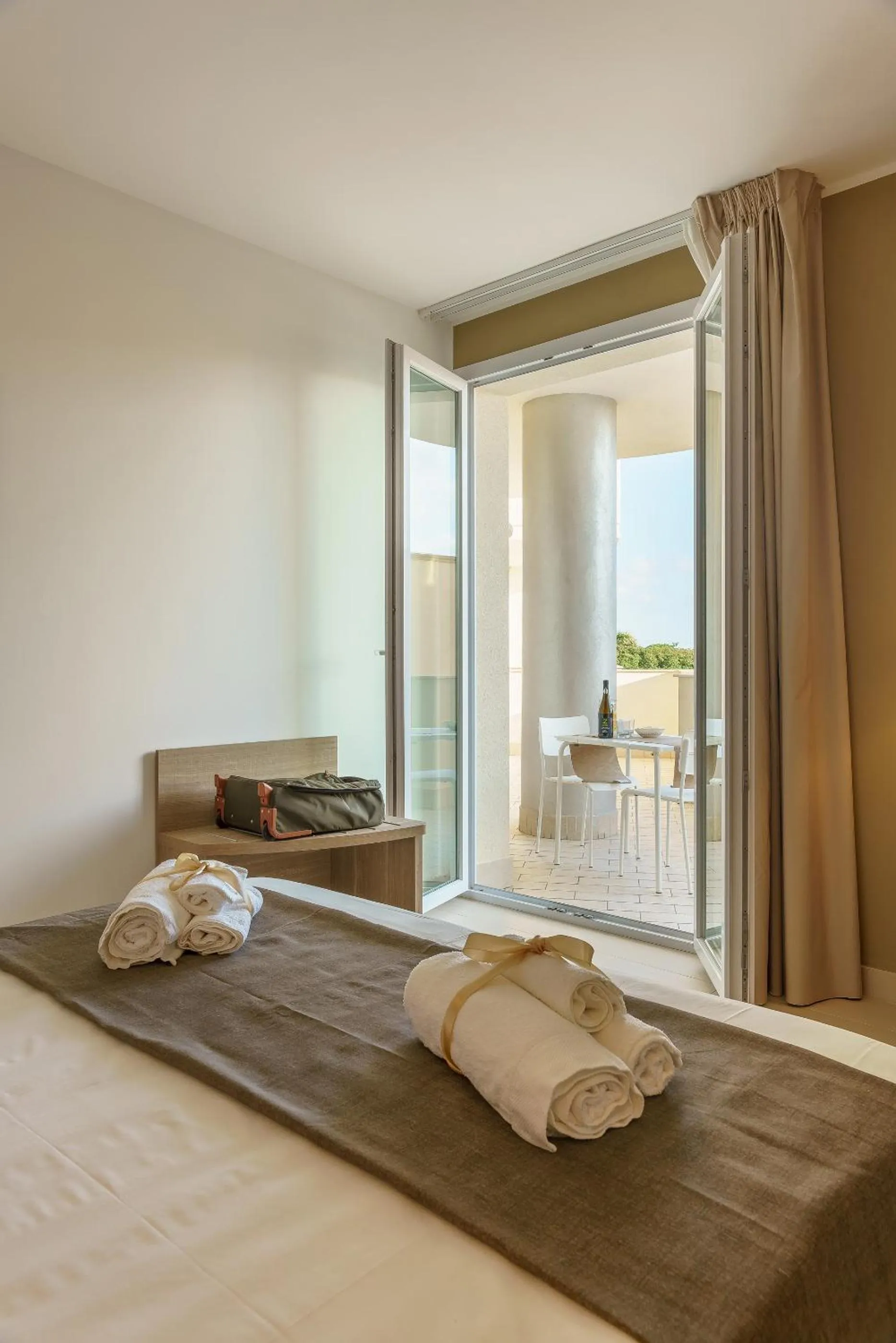 Bed in Travini Hotel Residence