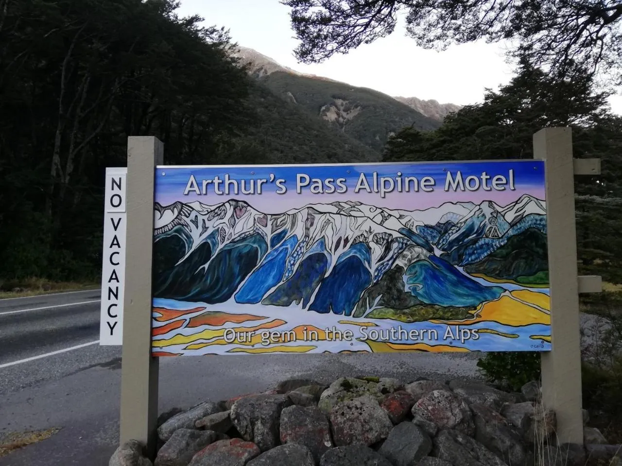 Property logo or sign in Arthur's Pass Alpine Motel