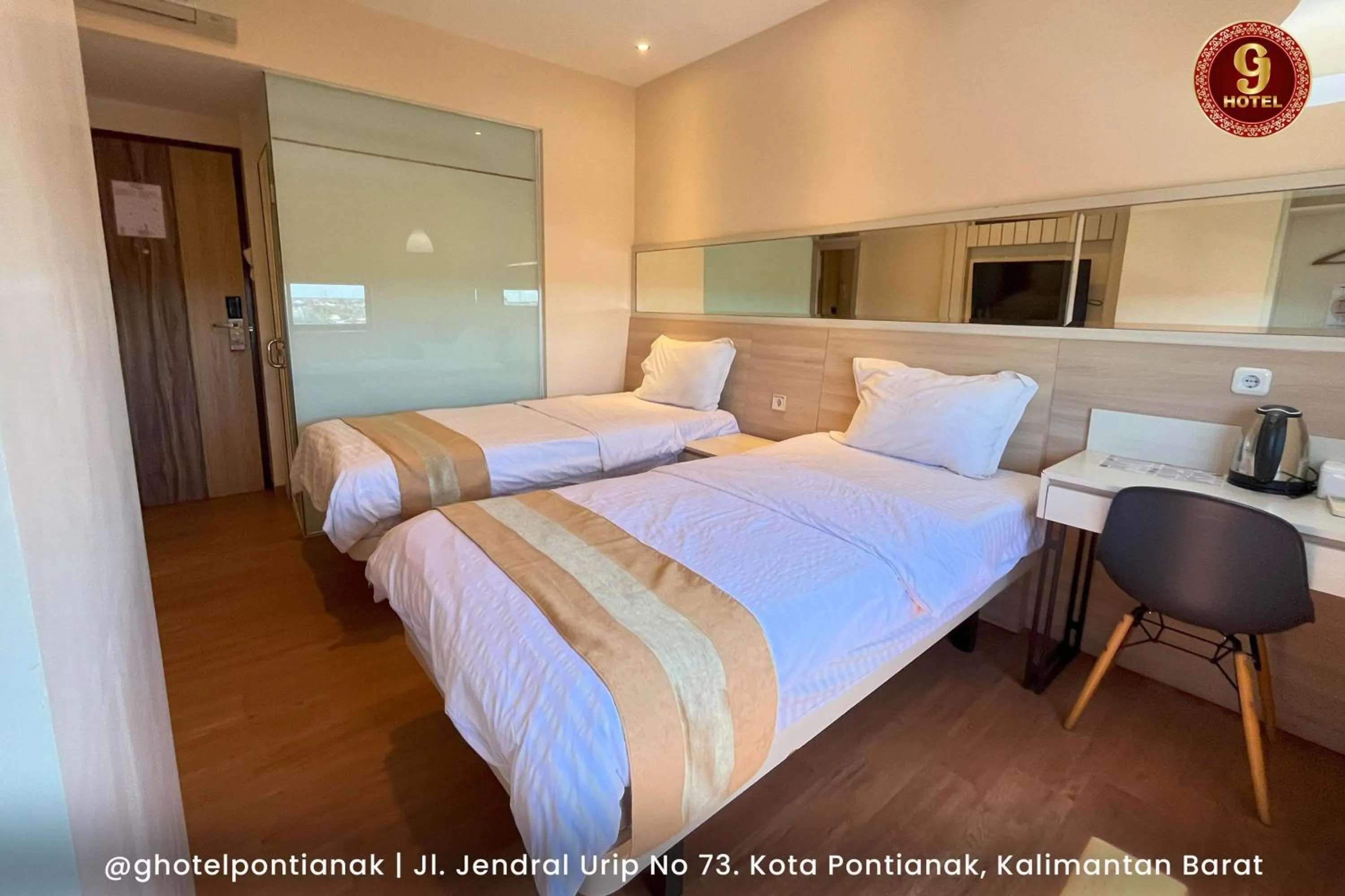 Bed in G-Hotel Pontianak