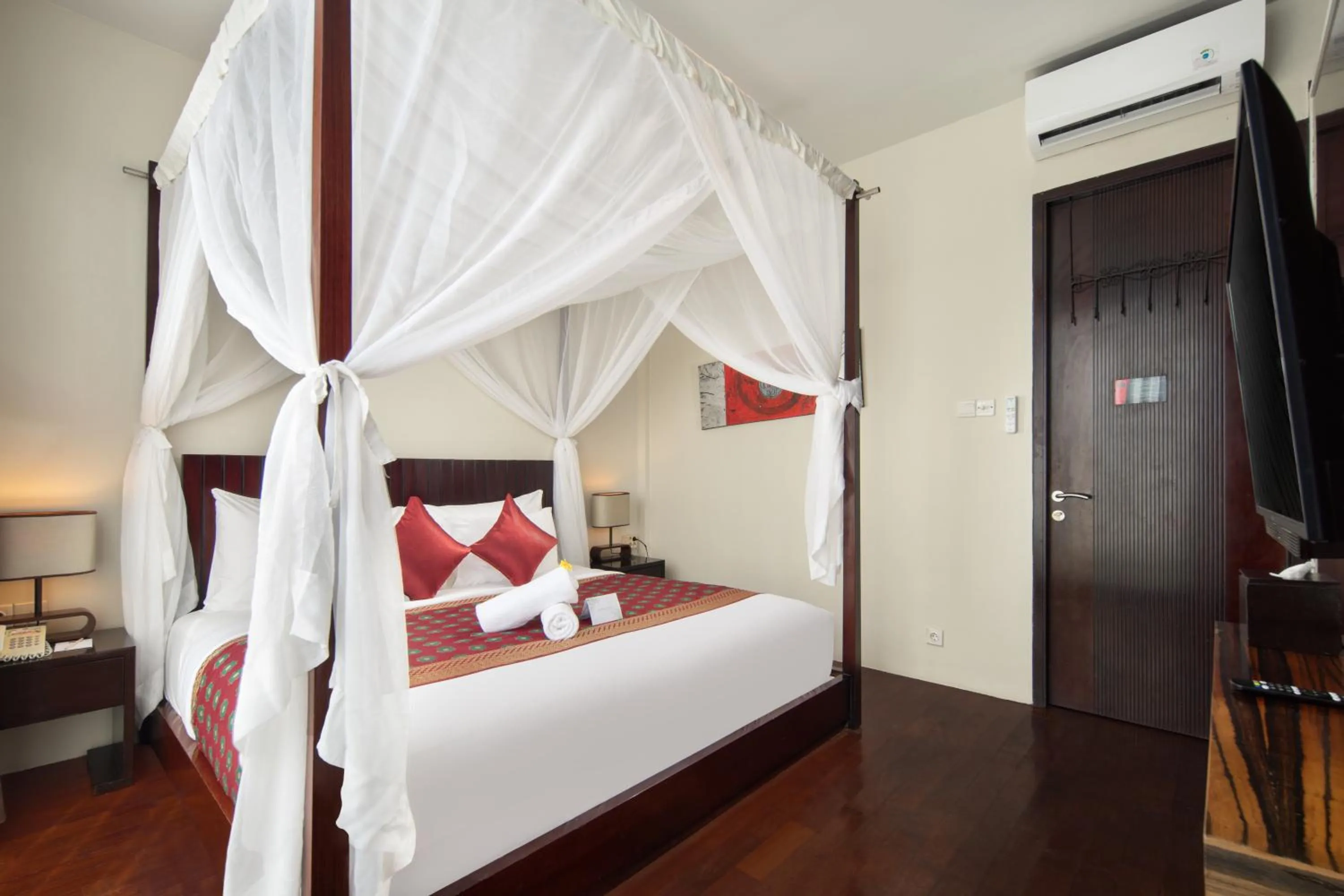 Bed in 18 Suite Villa Loft at Kuta