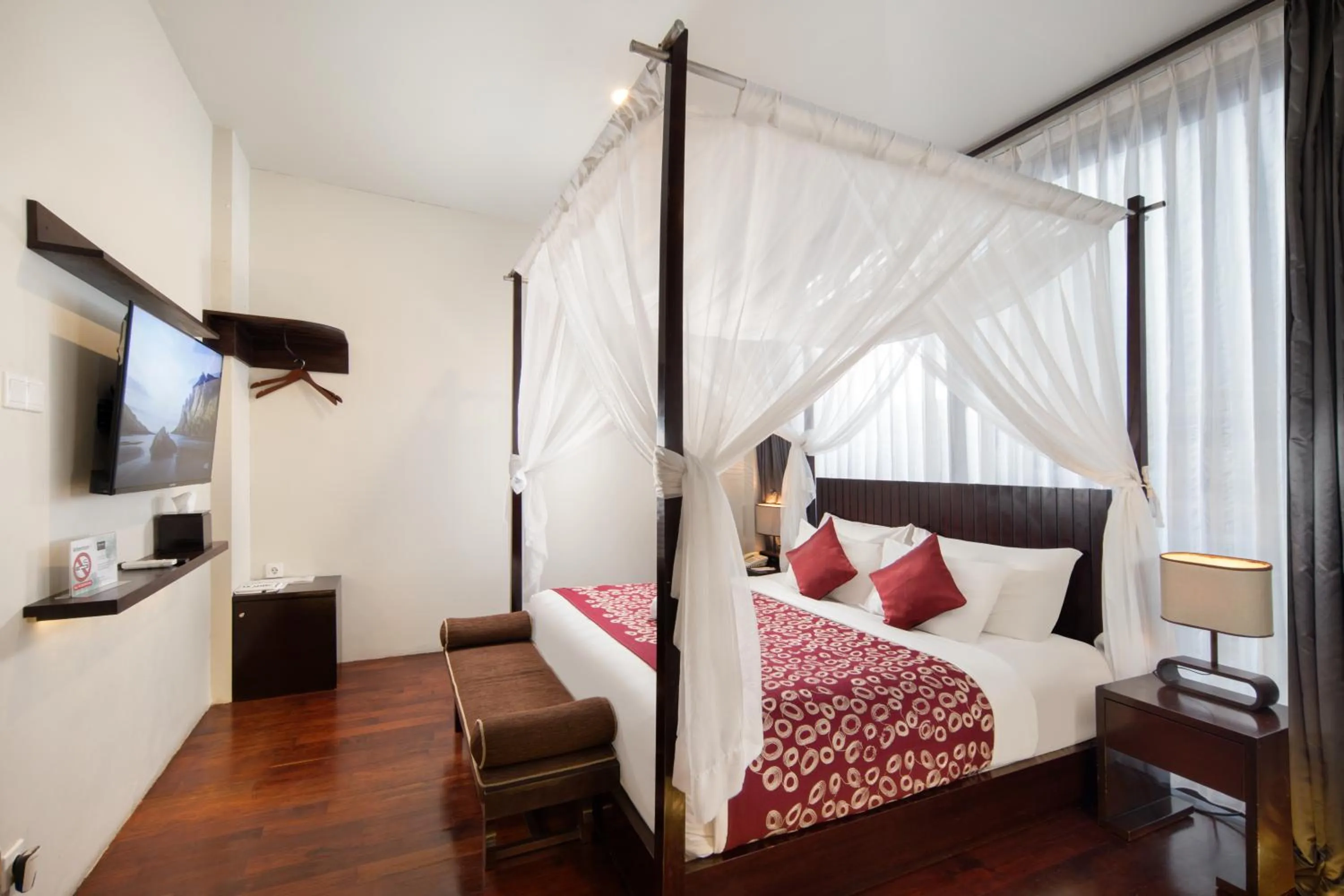 Bed in 18 Suite Villa Loft at Kuta