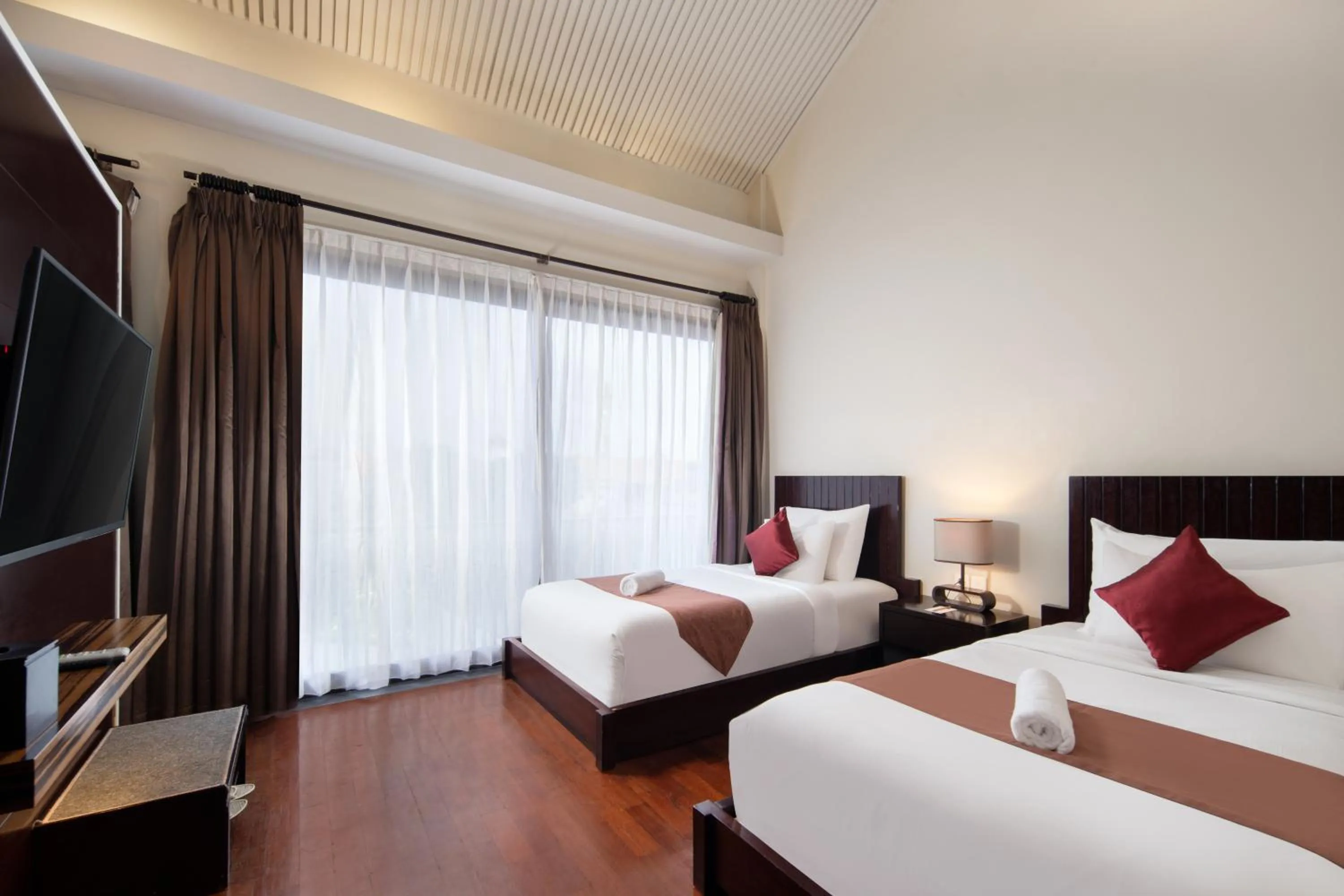 Bed in 18 Suite Villa Loft at Kuta