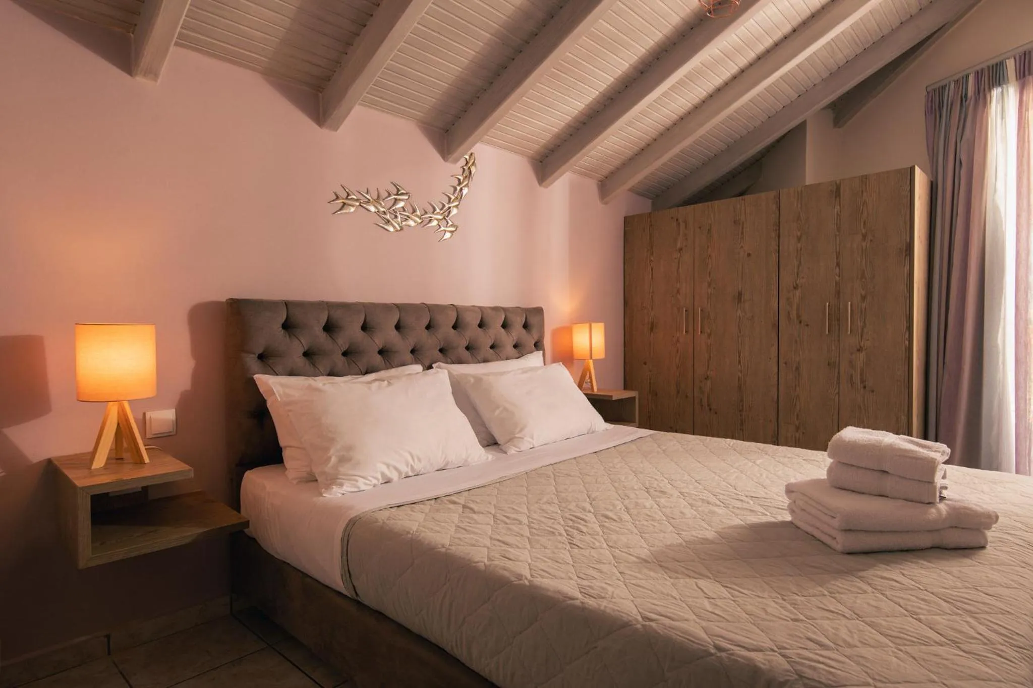 Bed in Koukos Loft Apartments