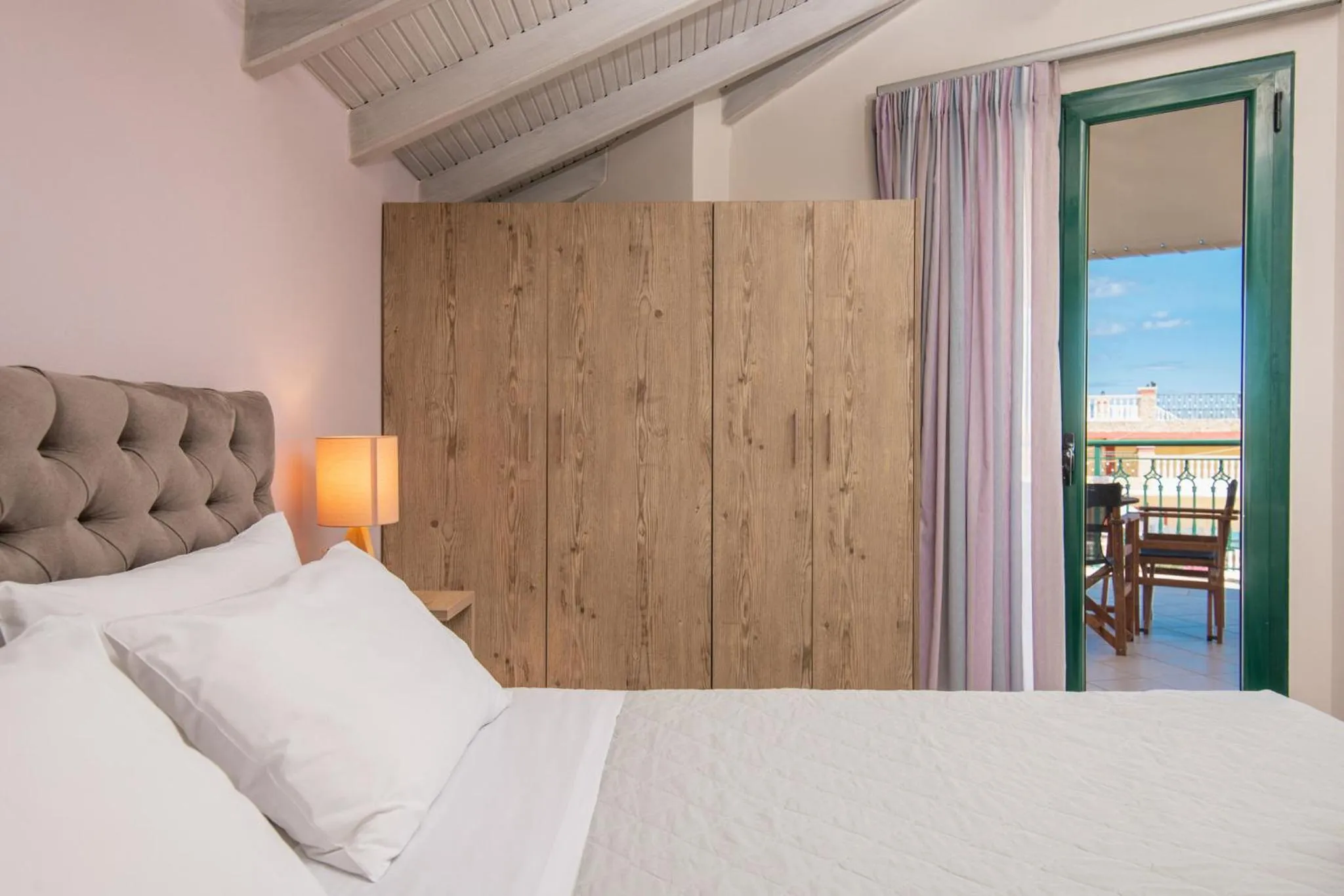 Bed in Koukos Loft Apartments