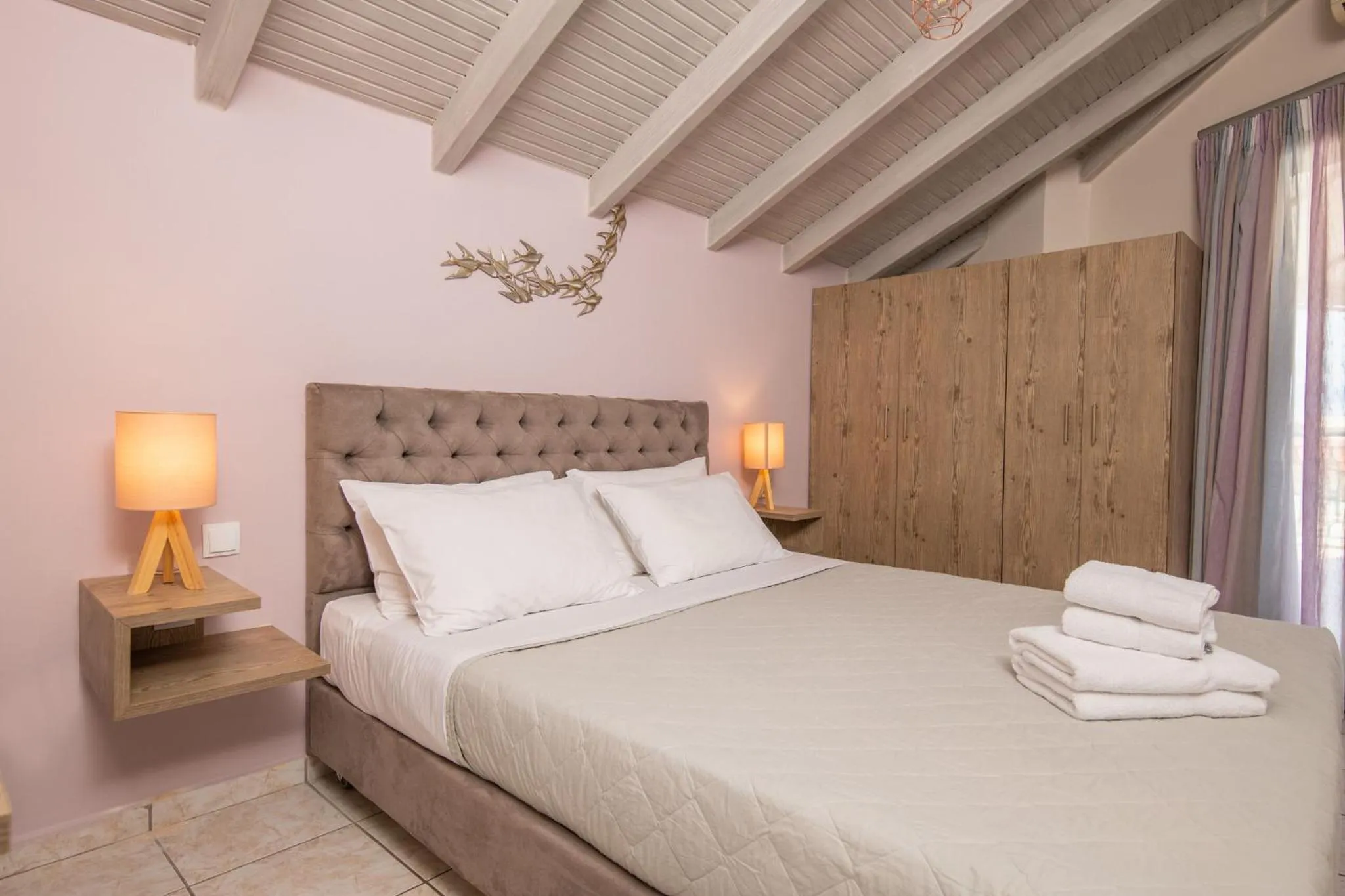 Bed in Koukos Loft Apartments