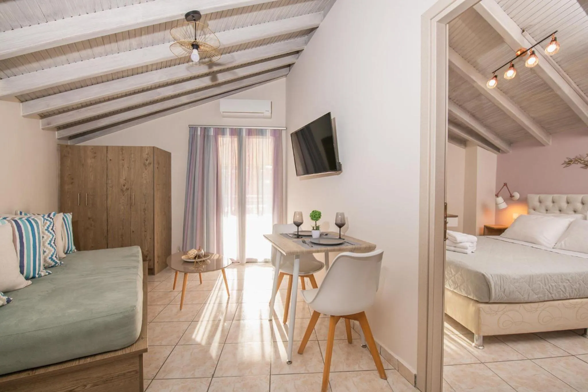 Bed in Koukos Loft Apartments