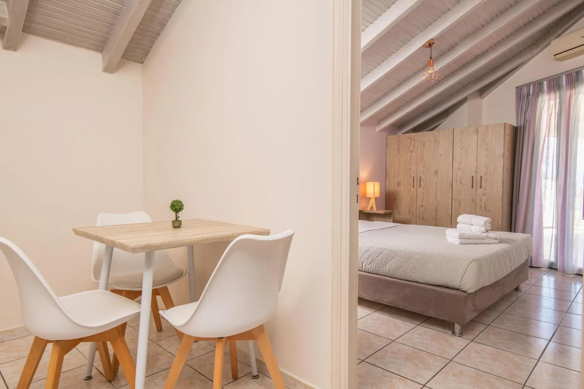 Bed in Koukos Loft Apartments