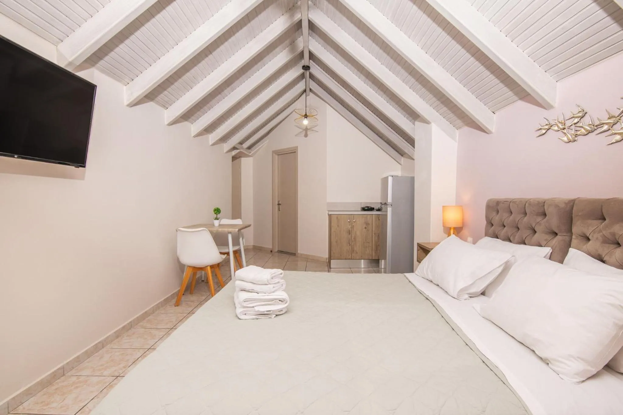 Bed in Koukos Loft Apartments