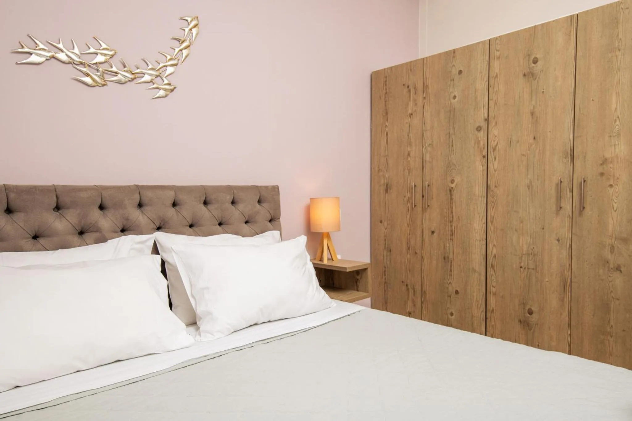 Bed in Koukos Loft Apartments