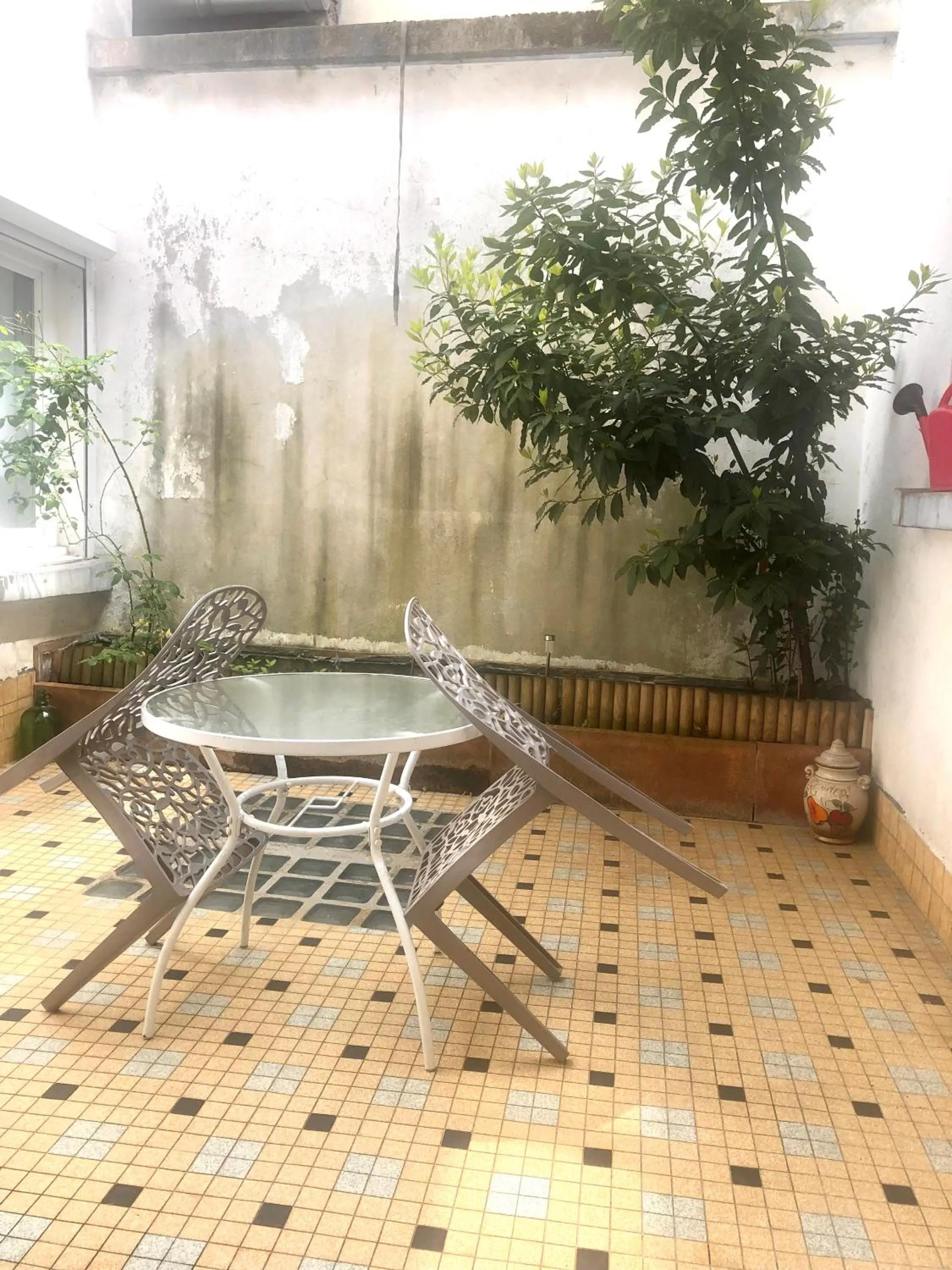 Patio in AUX DEUX CIGOGNES AMMERSCHWIHR