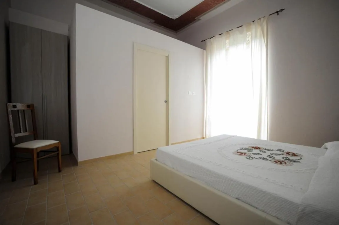 Photo of the whole room, Bed in La Mela Rosa