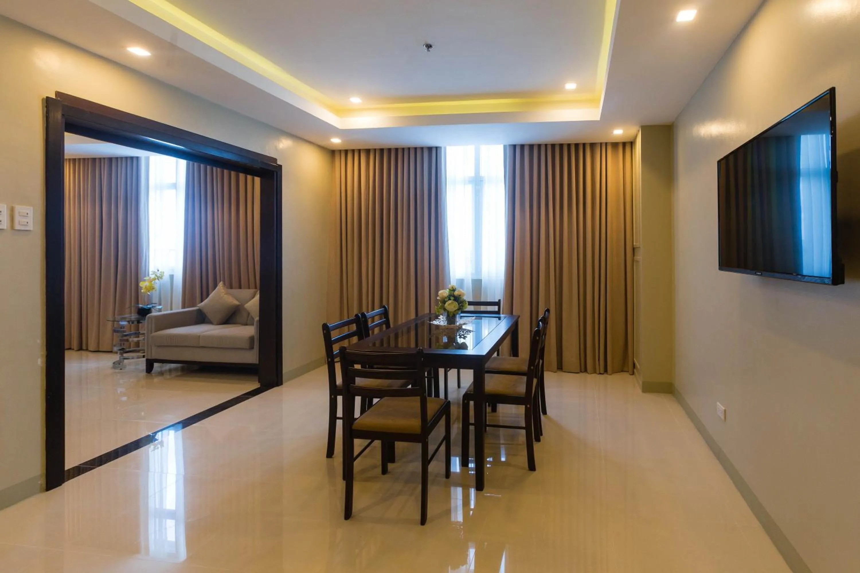 Seating area, Bed in Iloilo Gateway Hotel and Suites
