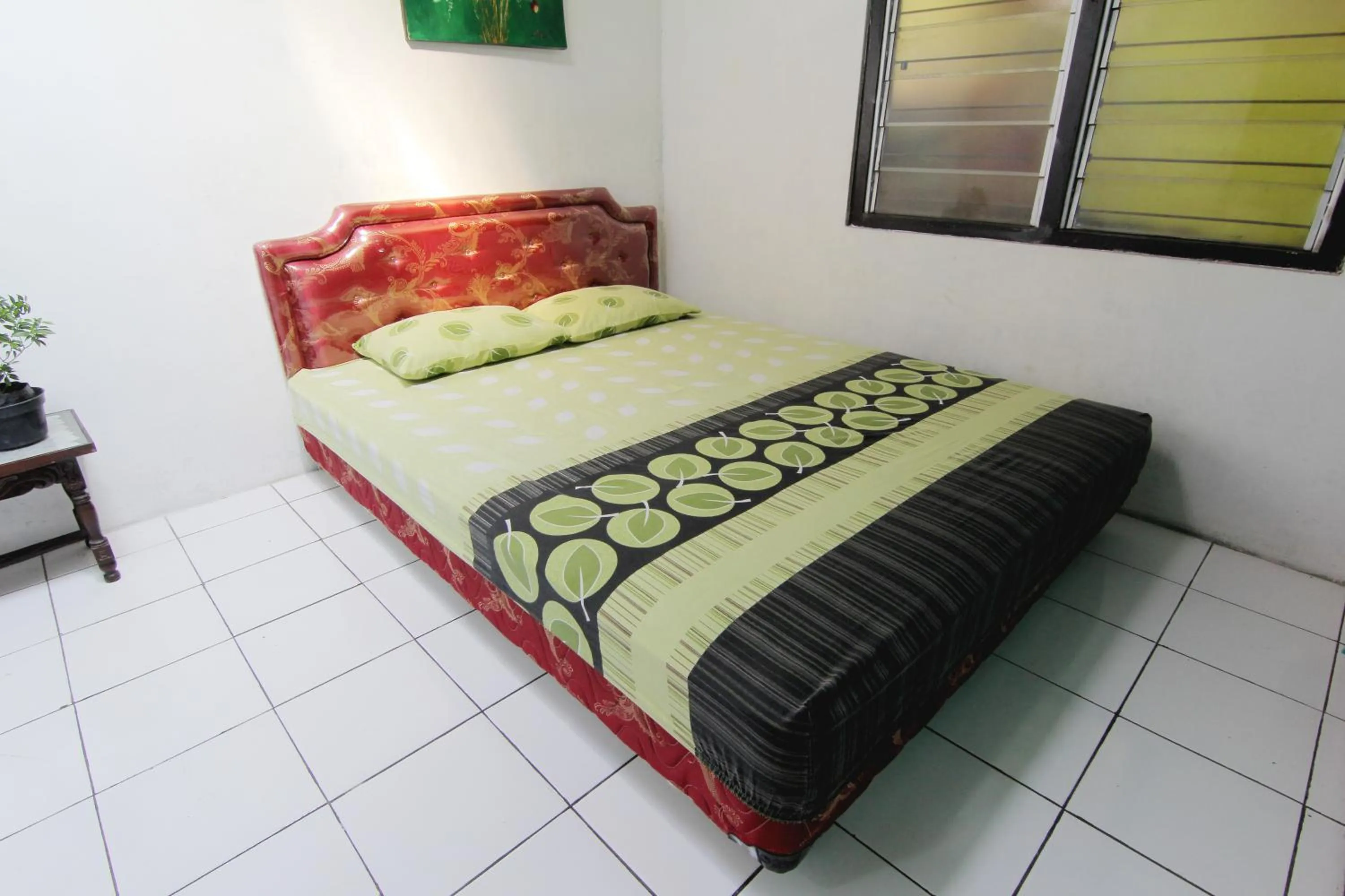 Bed in Batik Trinidar Homestay