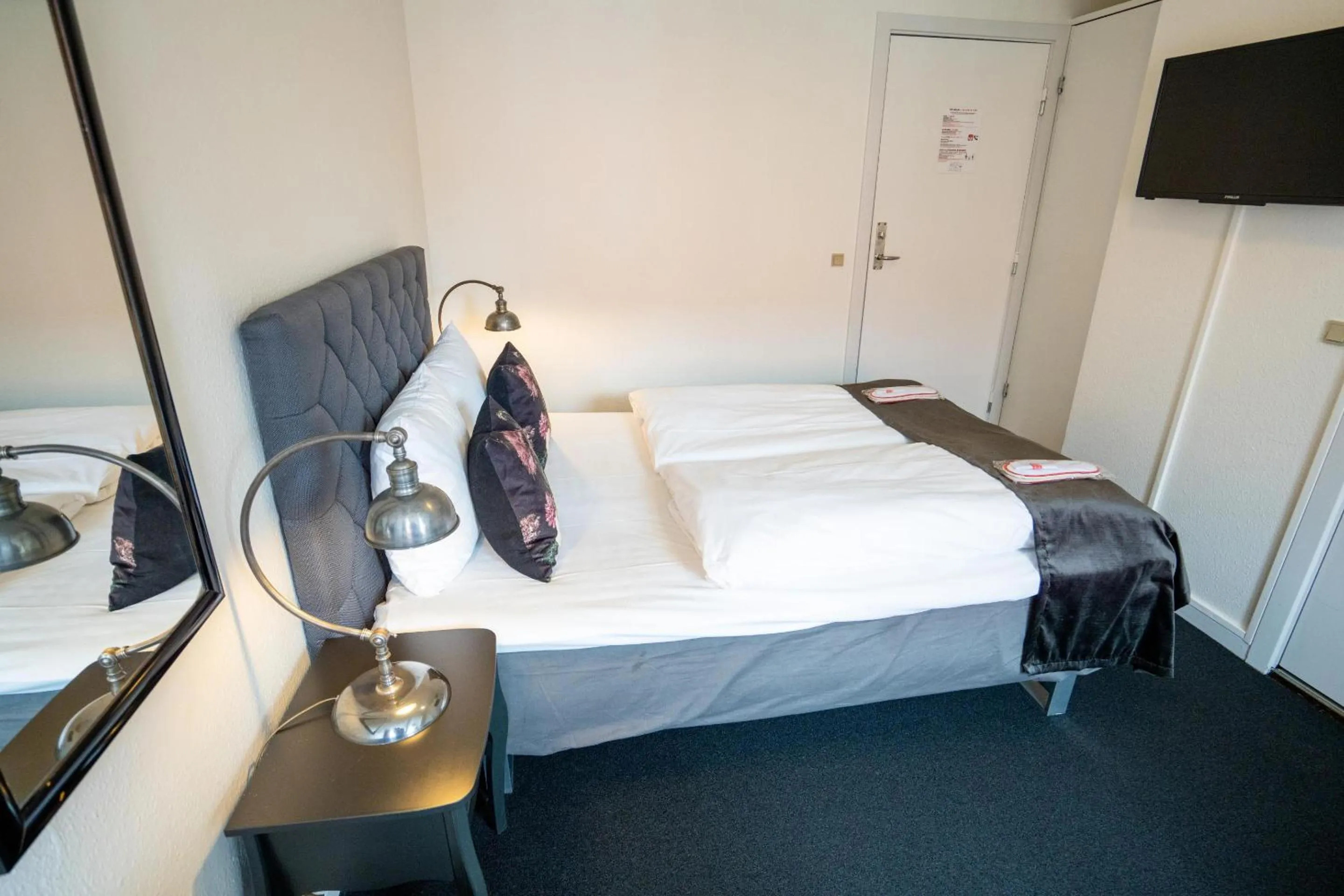 Bed in Hotel Vinhuset