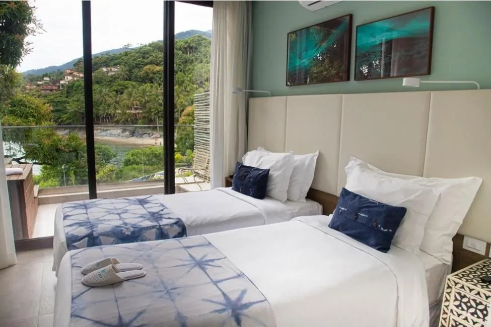 View (from property/room), Bed in Casa Di Sirena Ilhabela