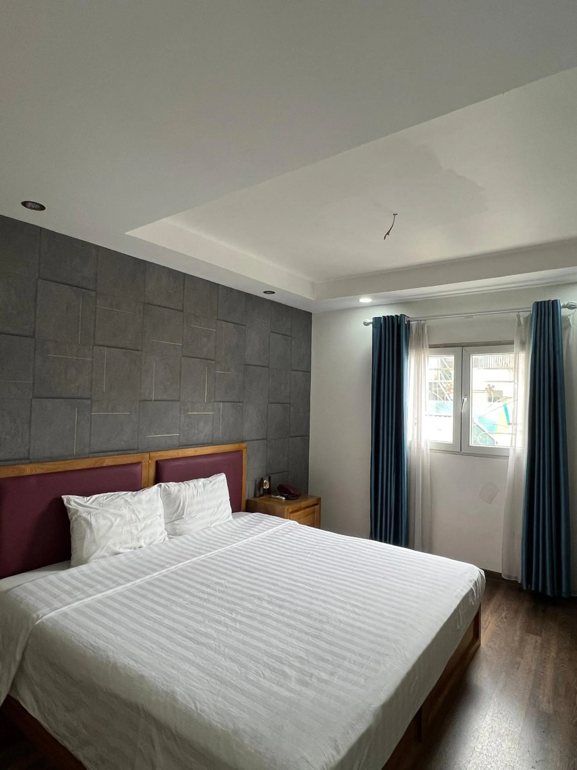 Bed in Holiday Suites Hotel & Spa