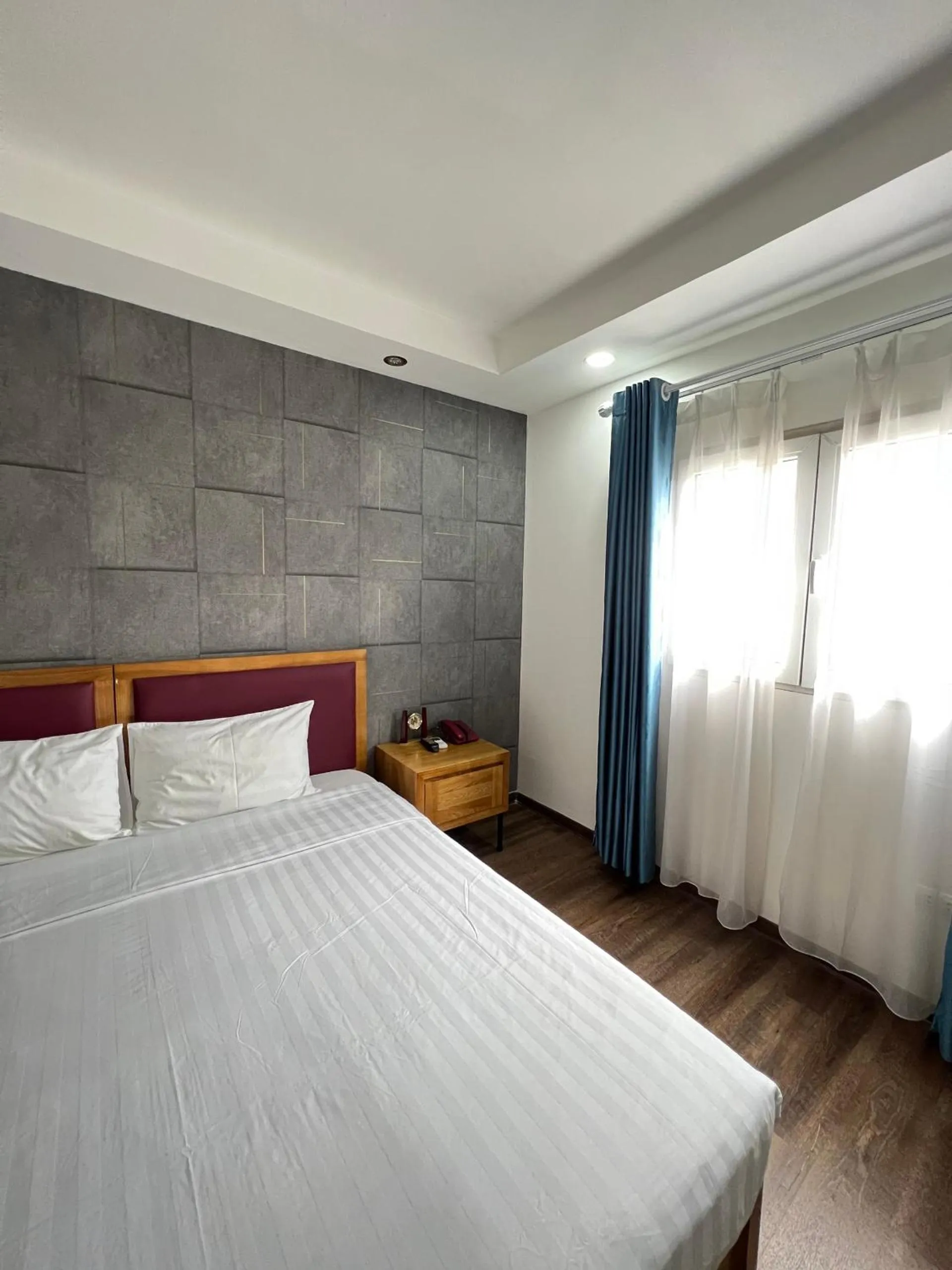 Bed in Holiday Suites Hotel & Spa