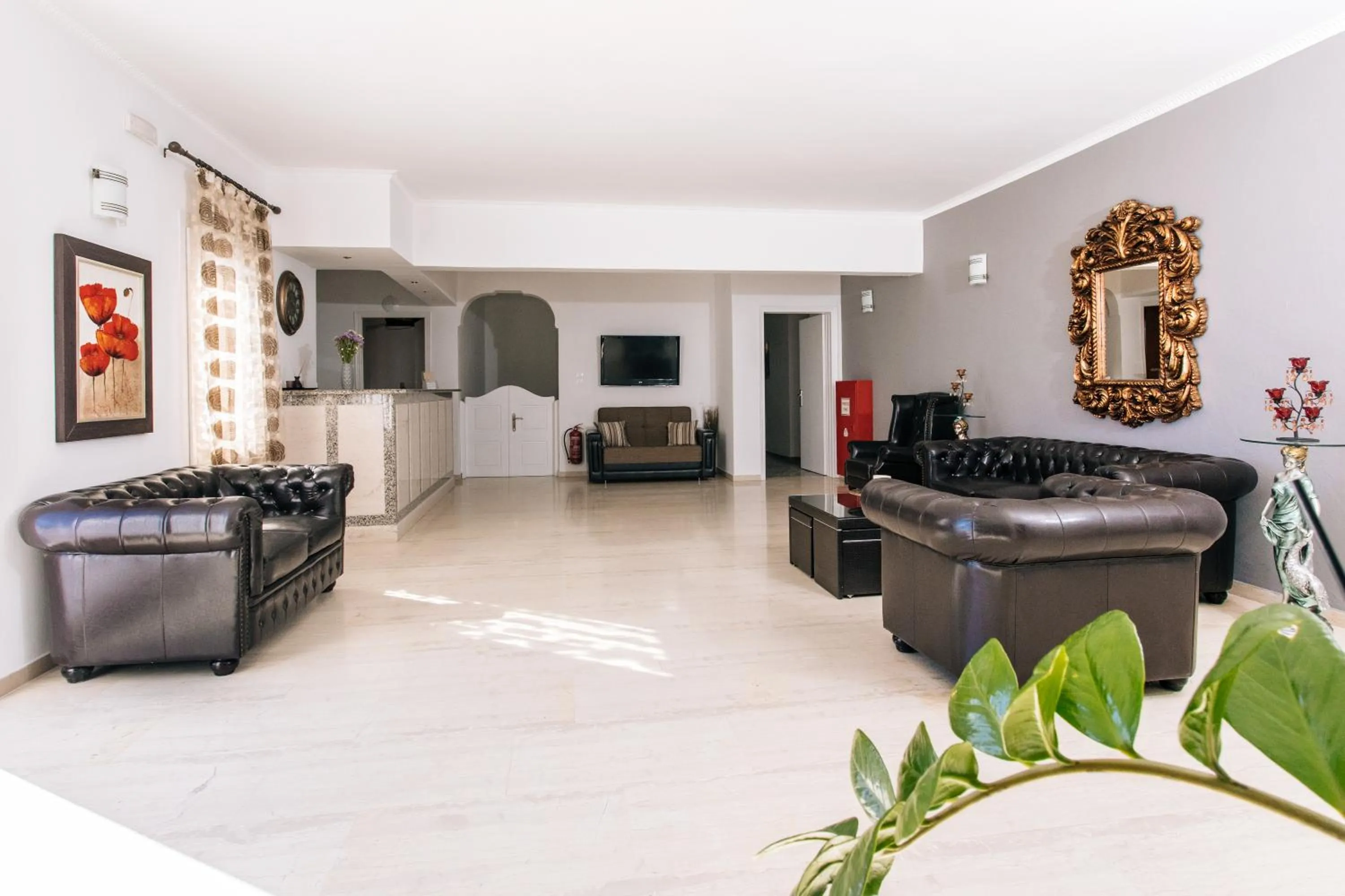 Communal lounge/ TV room in Nikos Hotel