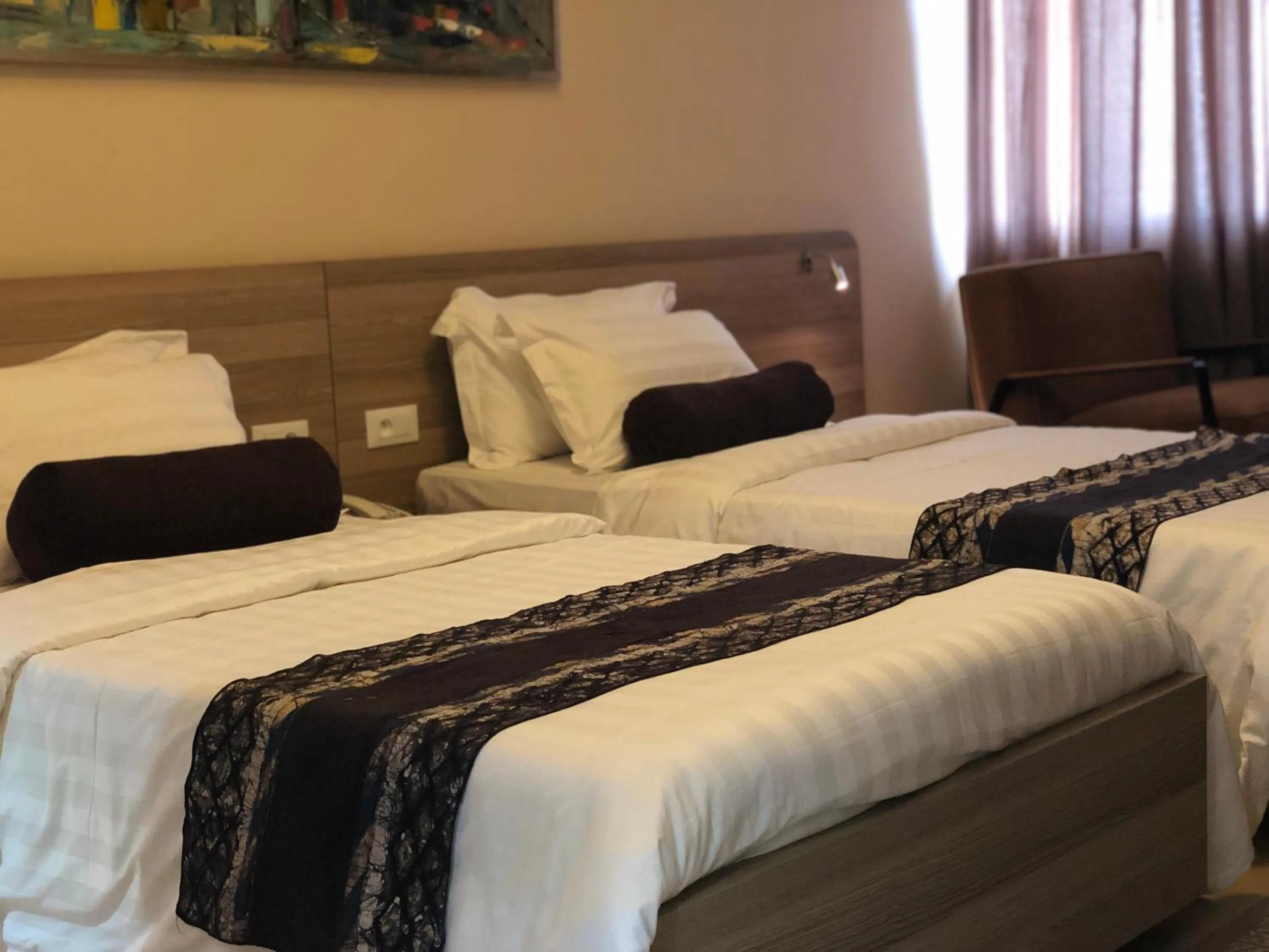 Bed in Roots Hotel Apartments Abidjan