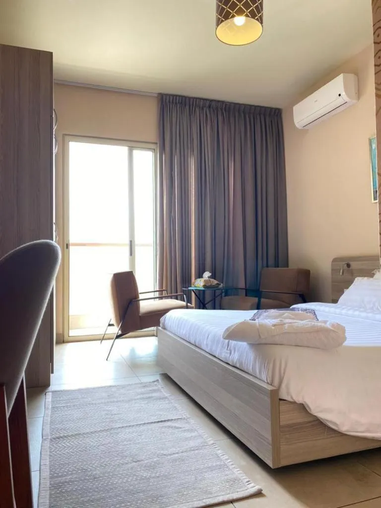 Bed in Roots Hotel Apartments Abidjan