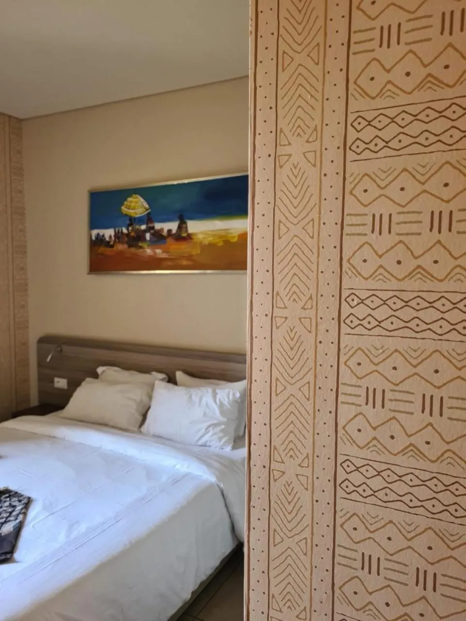 Bed in Roots Hotel Apartments Abidjan