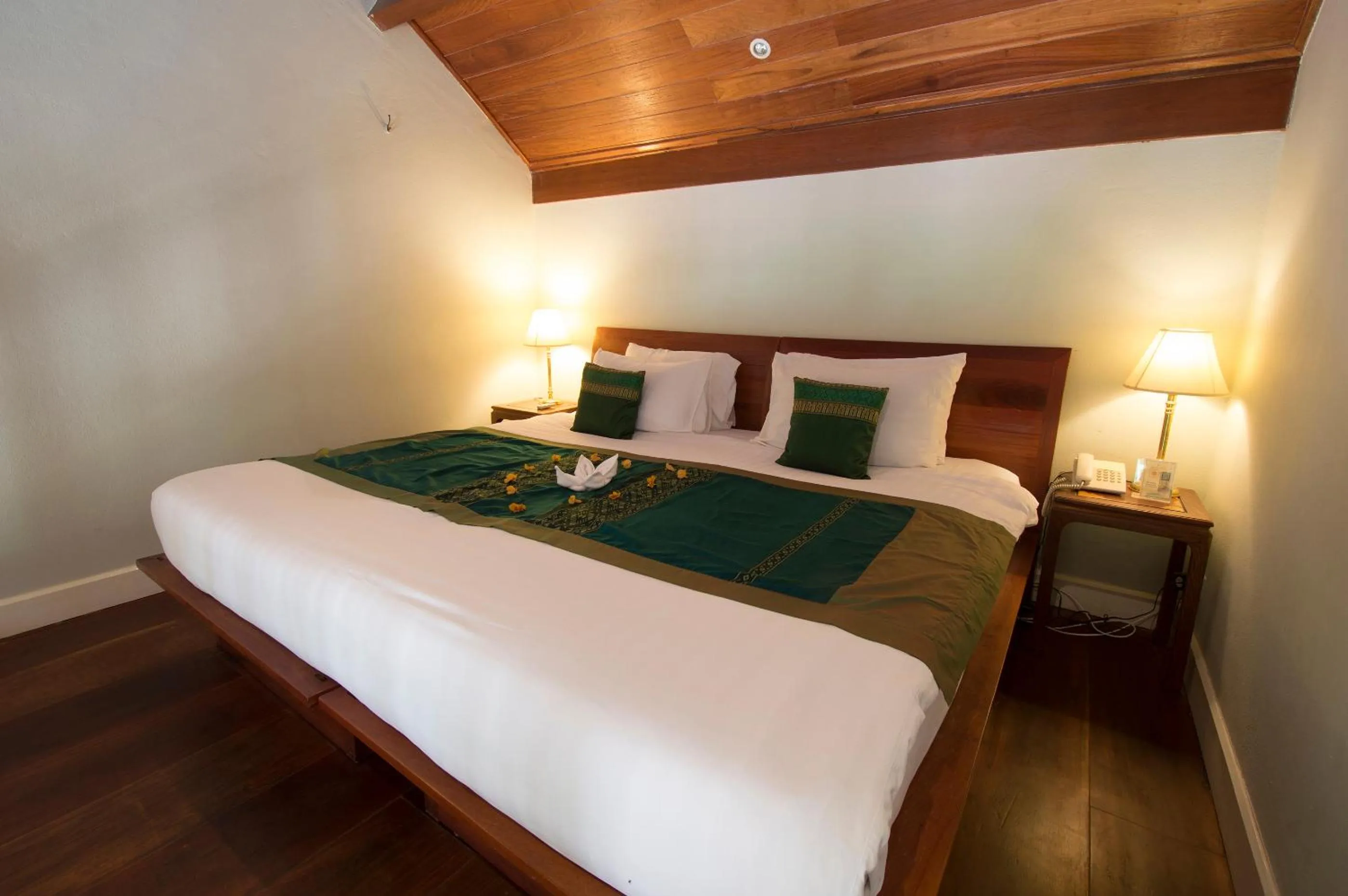 Bed in The Belle Rive Boutique Hotel