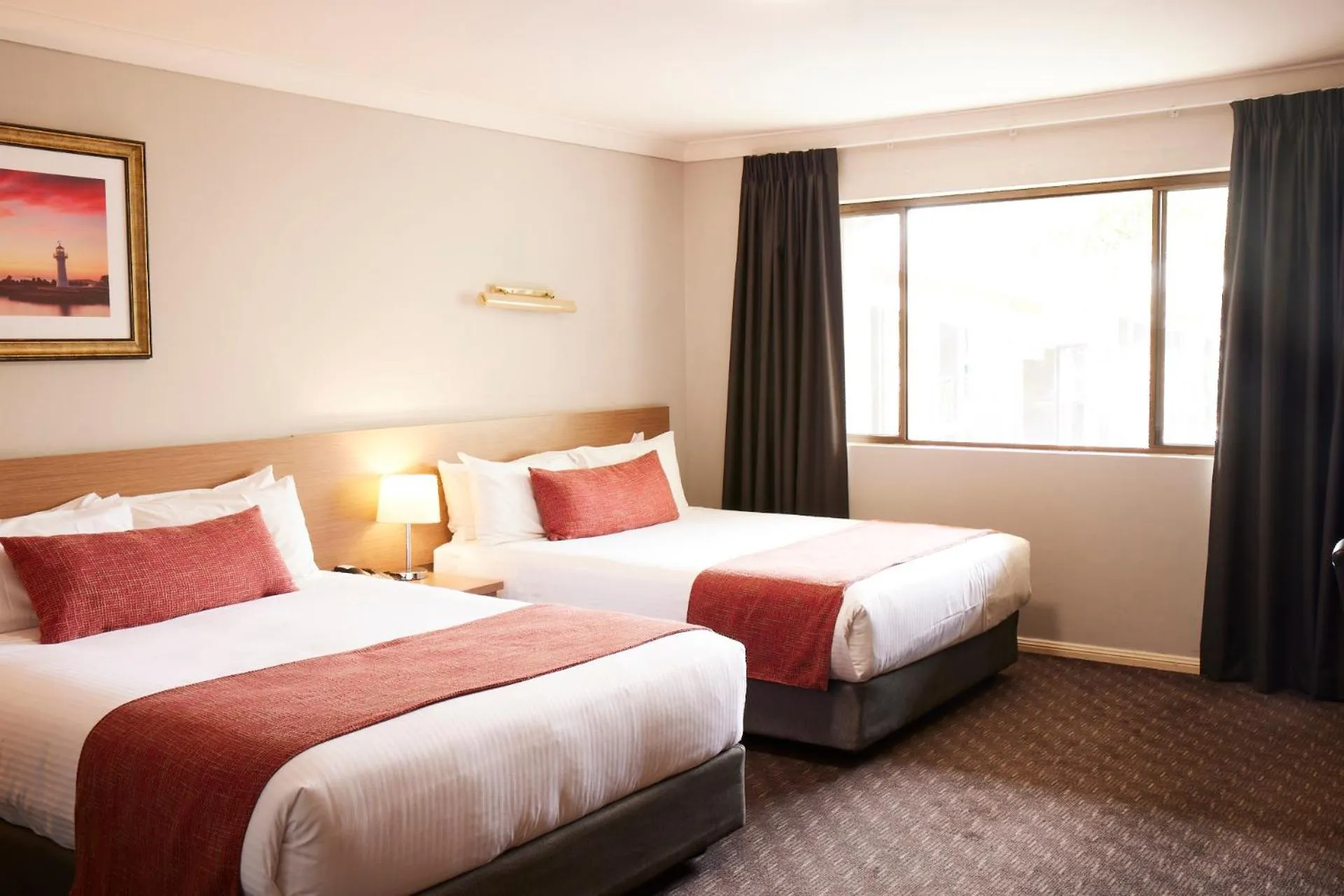 Bed in Ramada Hotel & Suites by Wyndham Cabramatta