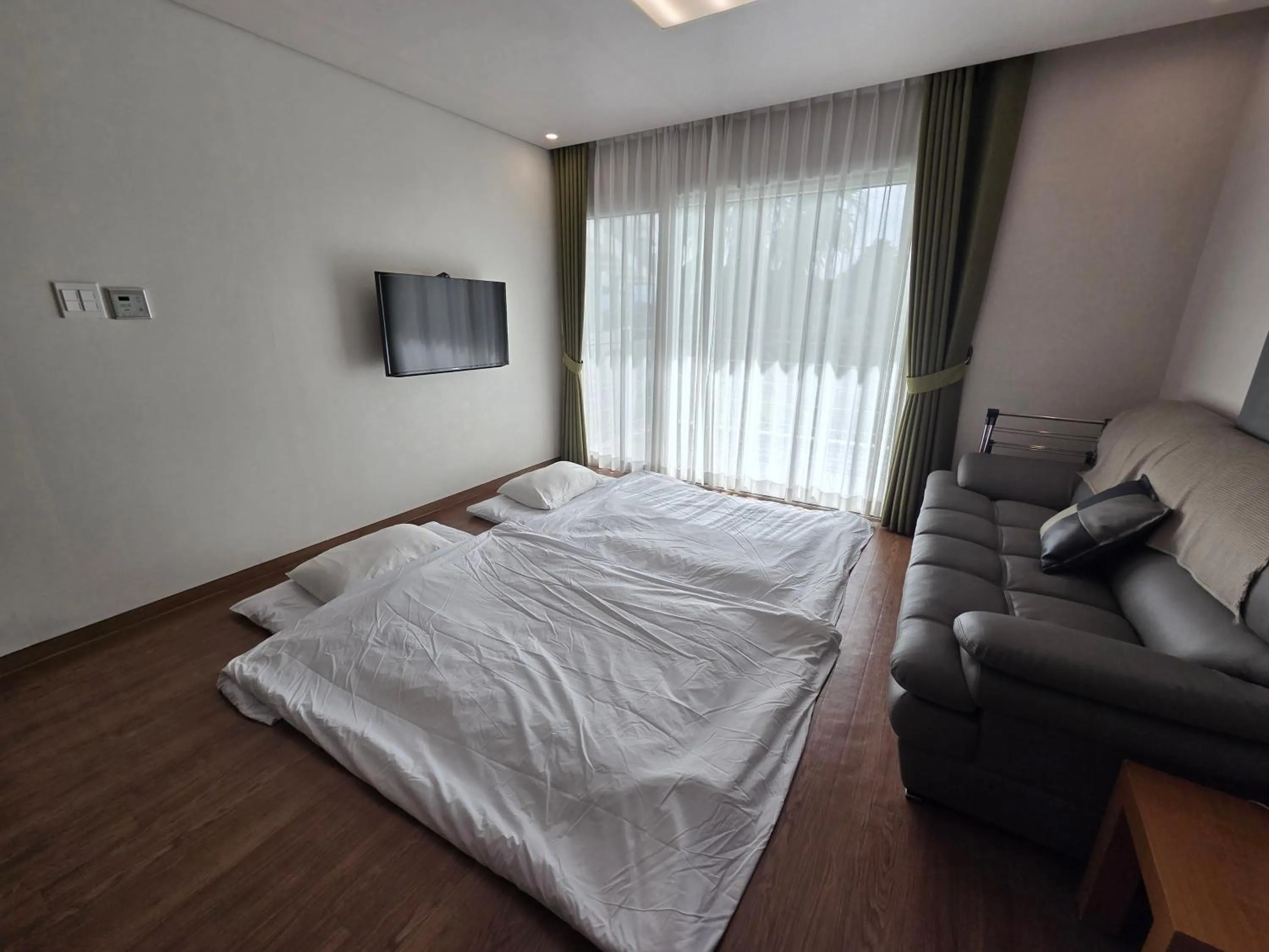 Living room, Bed in Y Resort Jeju