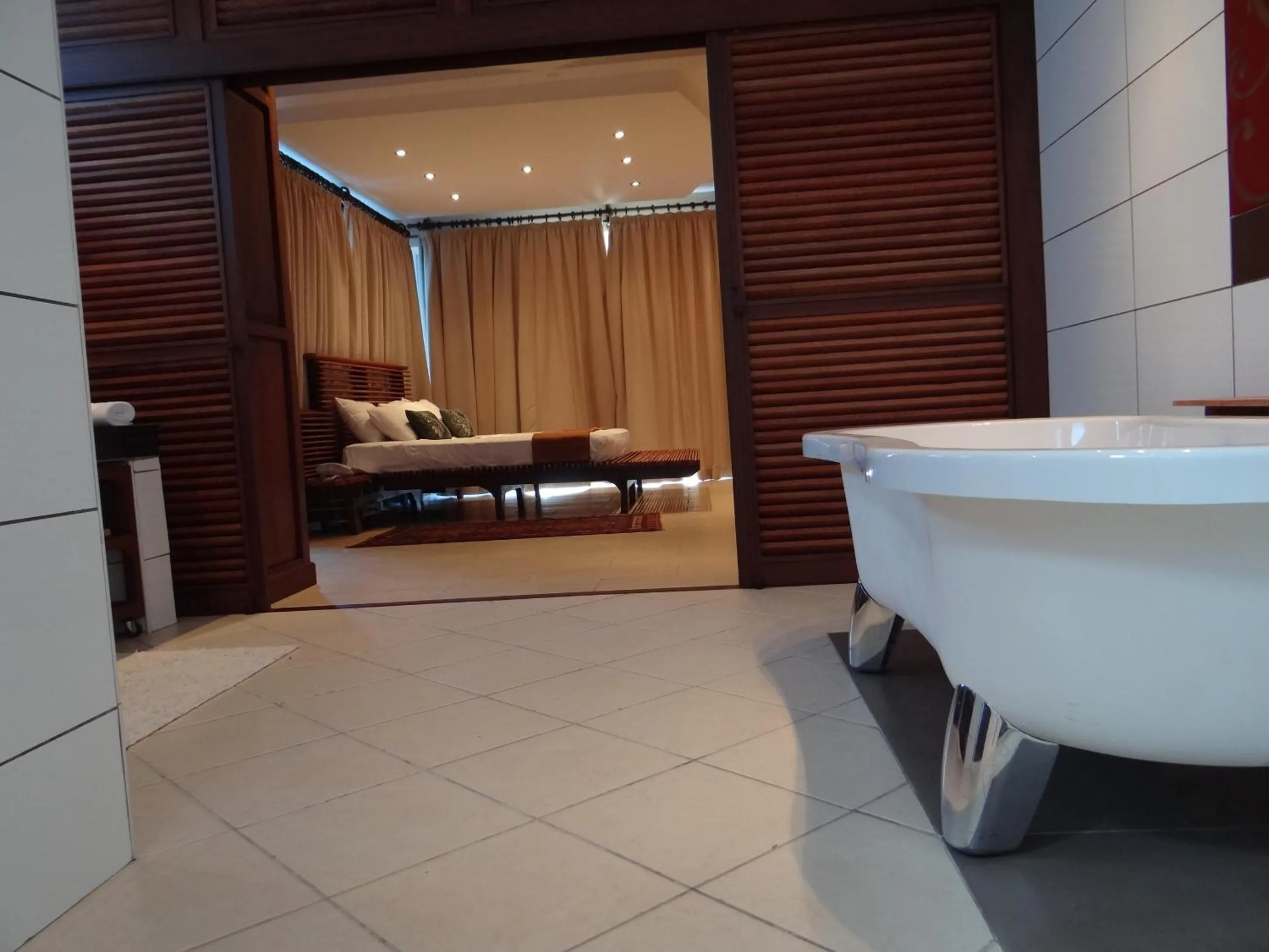 Bedroom, Bed in Cowrie Shell Beach Apartments Official